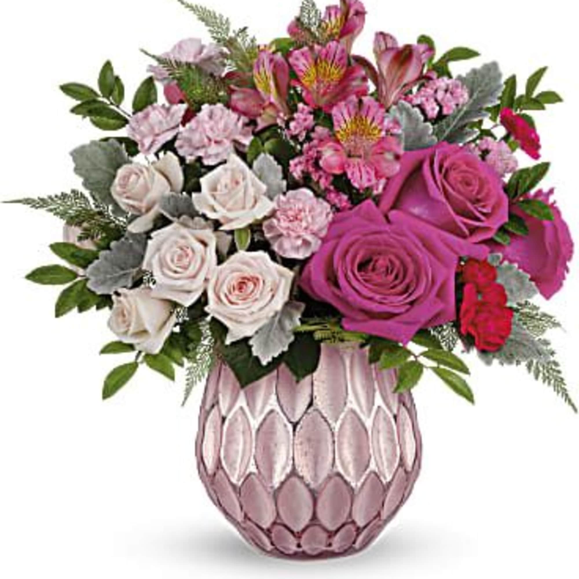 
Keep 'em blushing with the prettiest pink roses, presented to perfection in