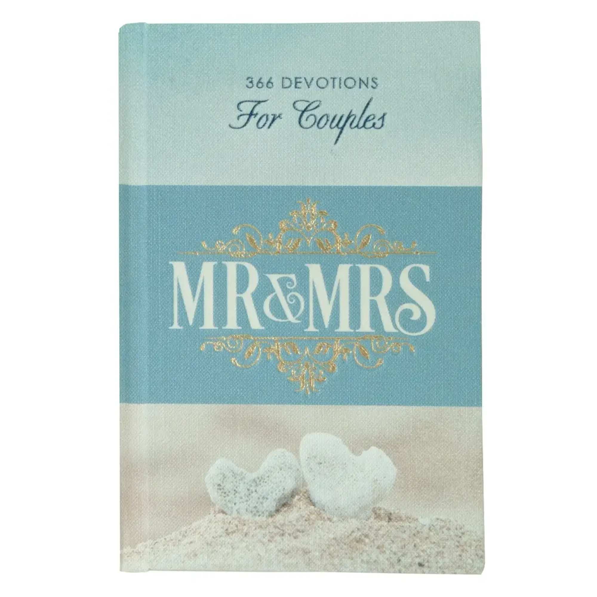 A blue book titled "MR & MRS" with two white heart stones on the cover