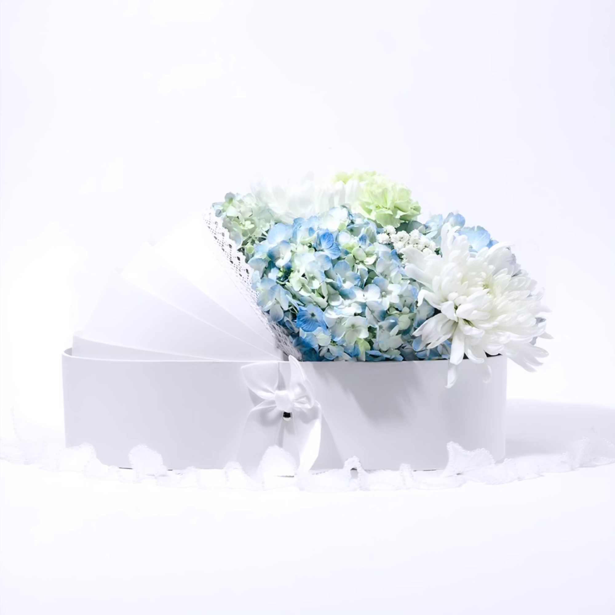 Blue and white bouquet in a white gift box