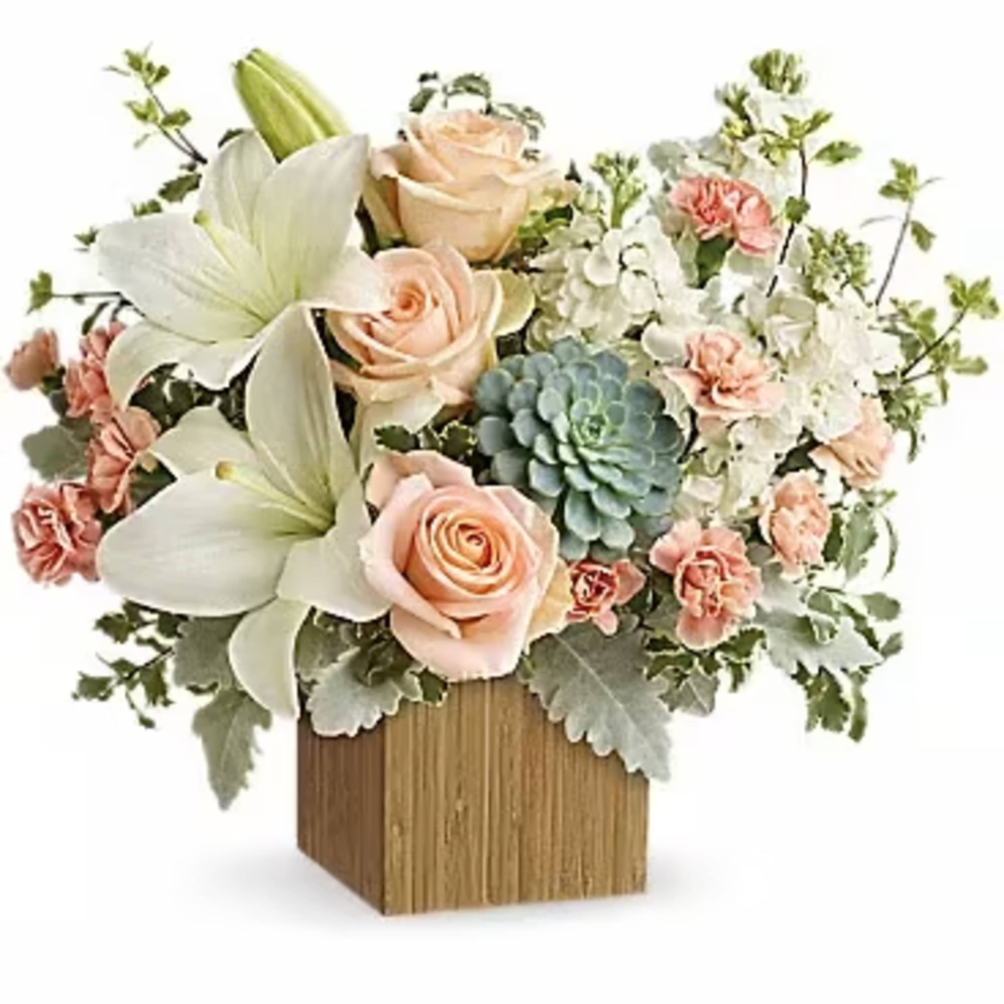 Arrangement of peach roses, white lilies, and pink carnations in a wooden cube vase