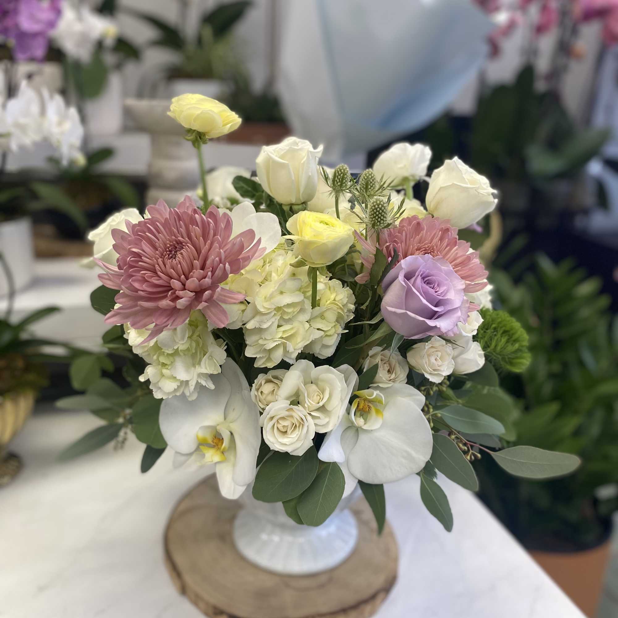 An artistic and bright arrangement, this crowd pleaser is as interesting as
