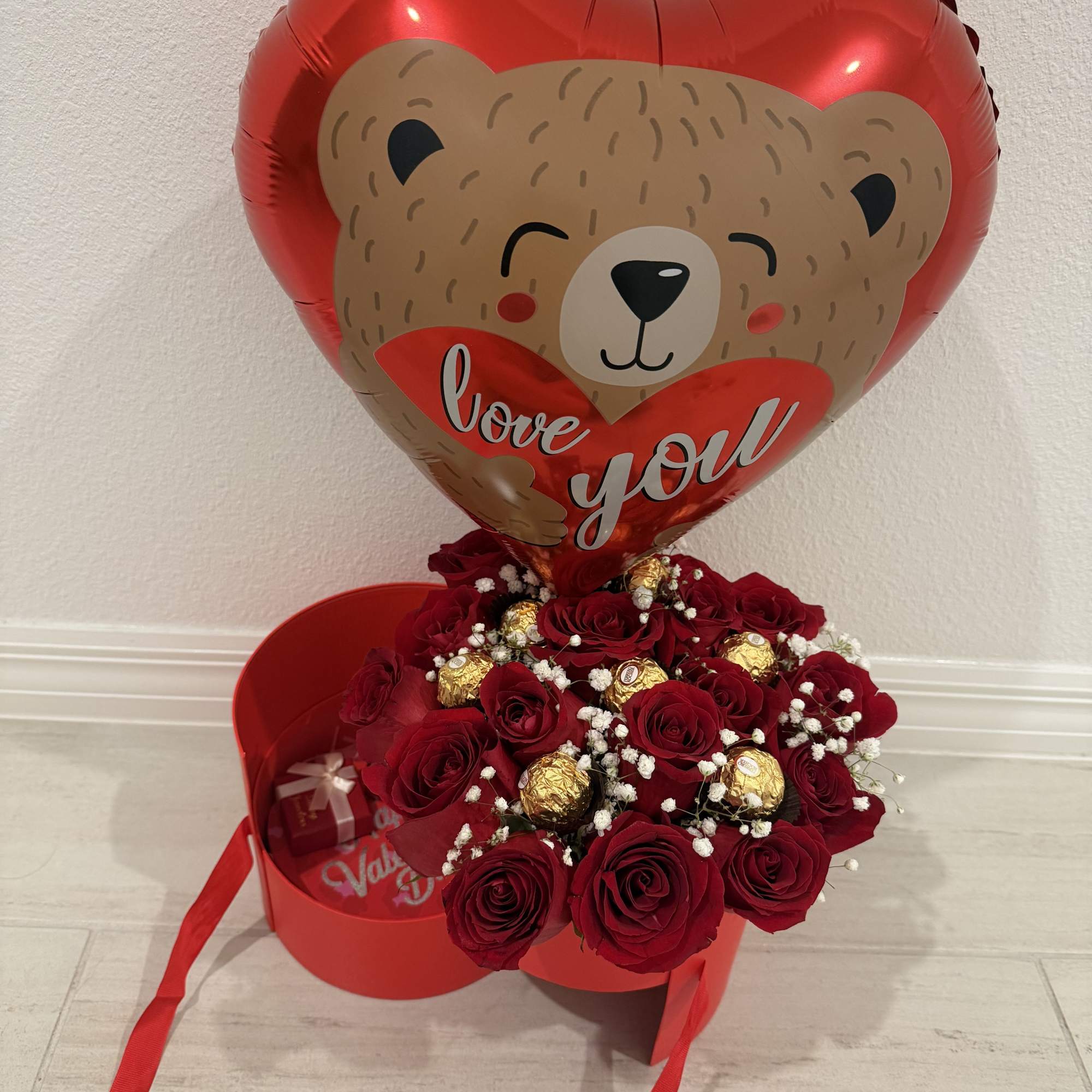 An elegant red round surprise box that opens to reveal space for, photo 2 of 2
