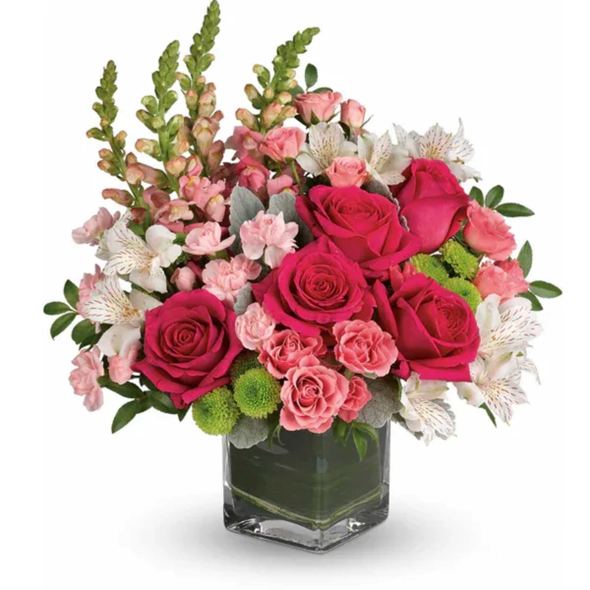 Pink roses and white alstroemeria in a clear glass vase