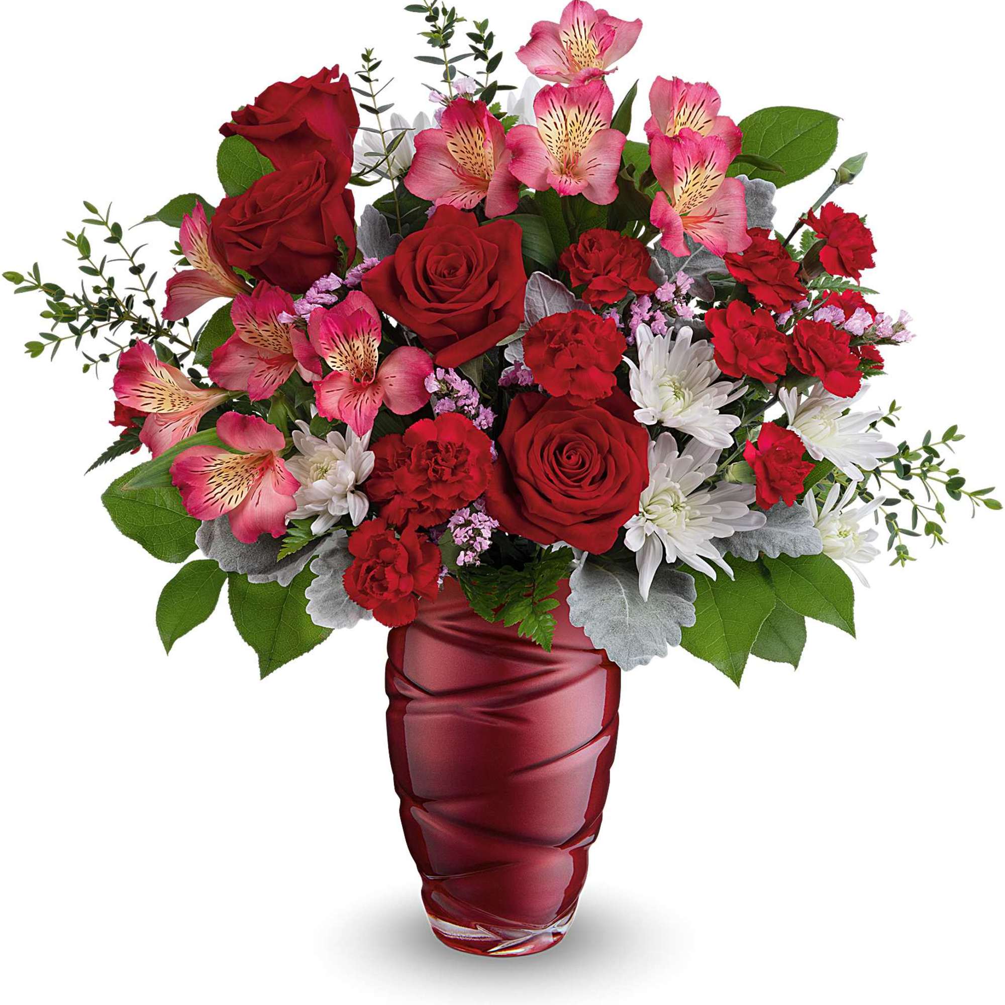 Red roses and pink alstroemeria in a red glass vase