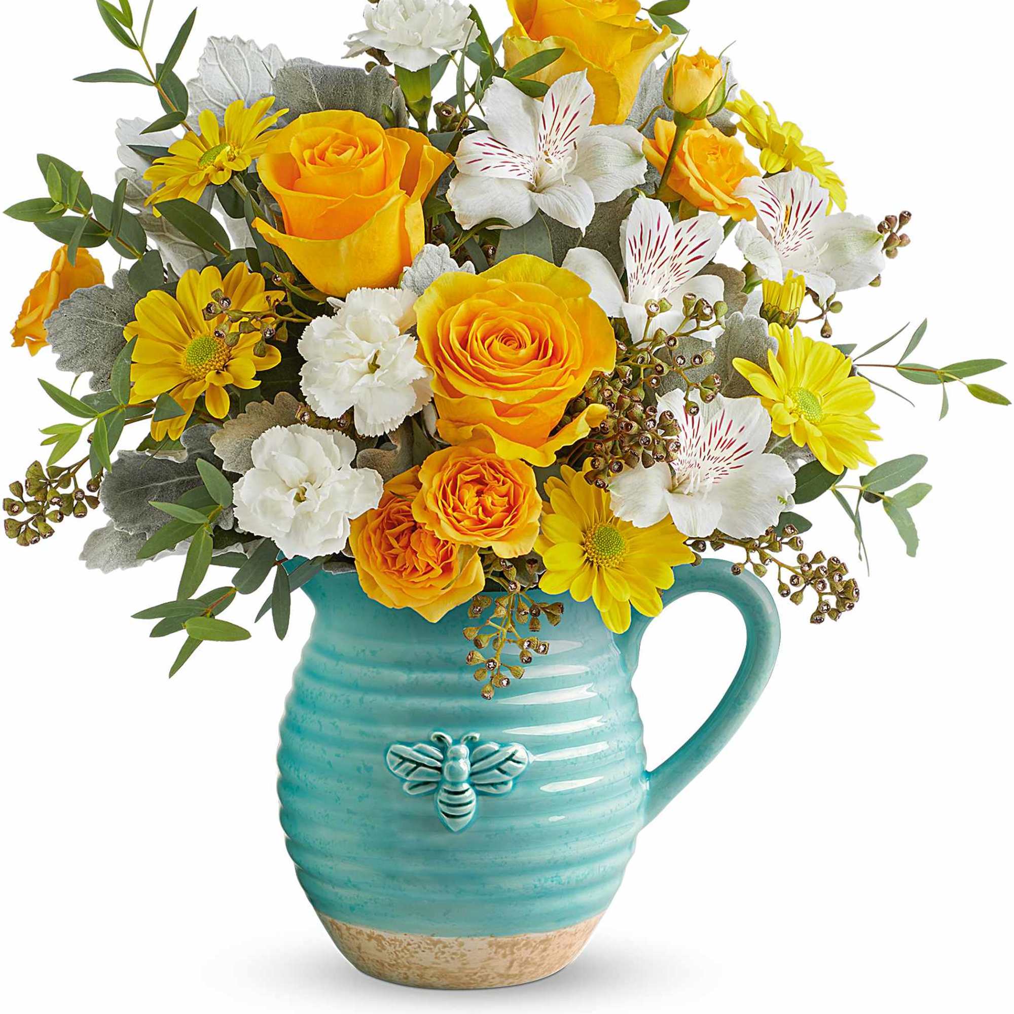 Yellow roses and white flowers in a turquoise mug vase
