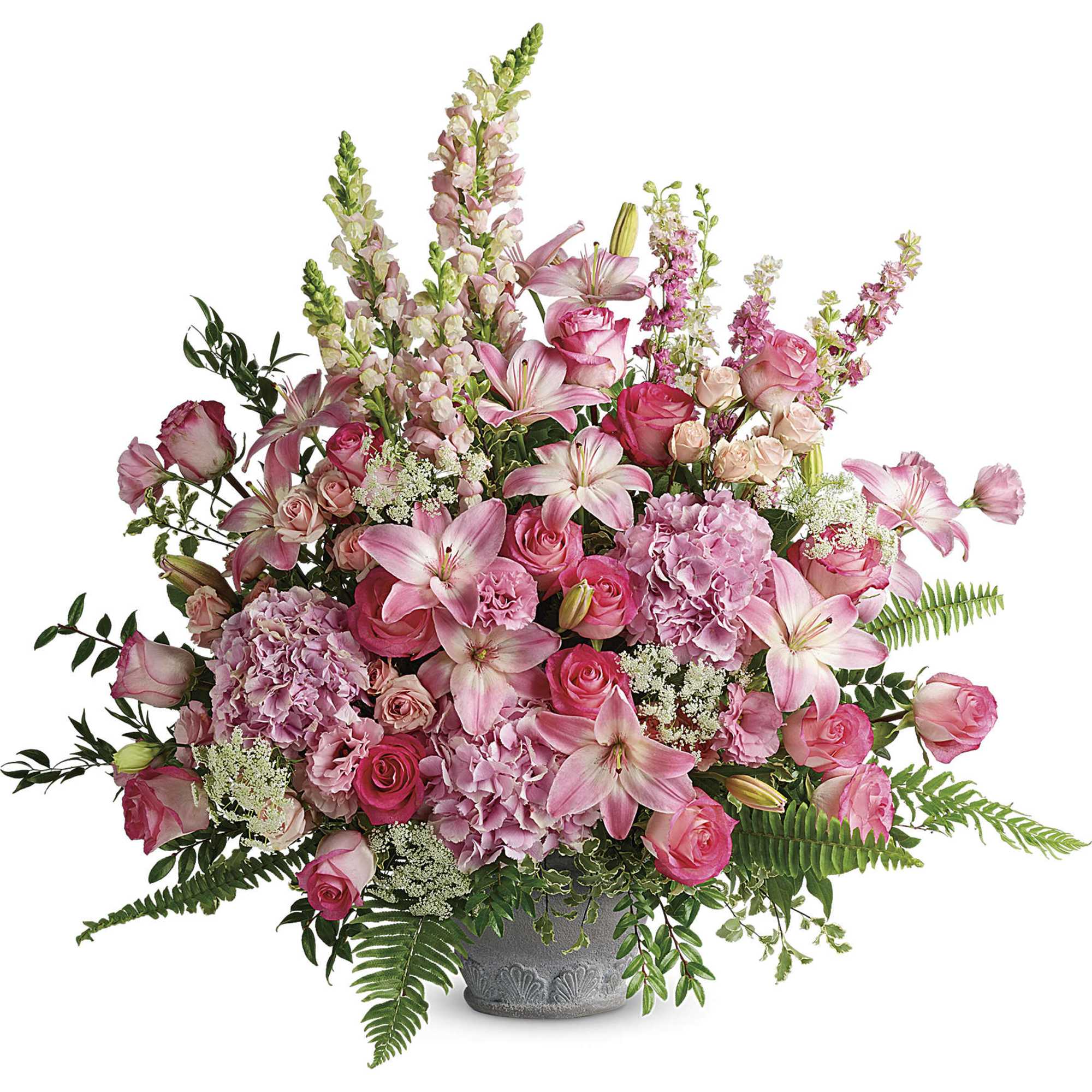 Pink mixed flower arrangement in a gray vase with tall blooms