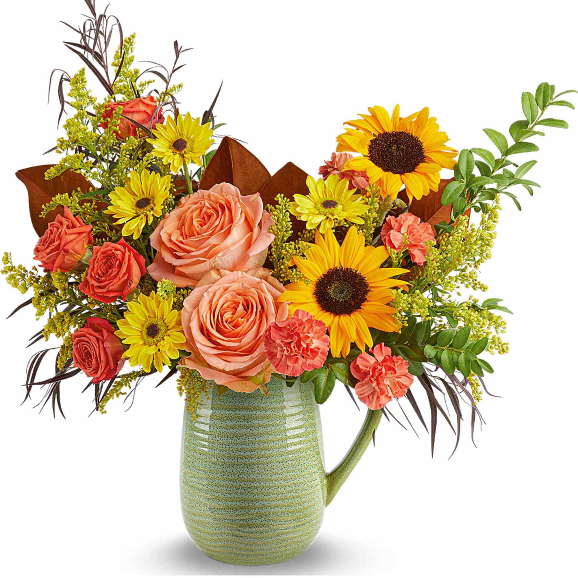 Mixed bouquet of roses, sunflowers, and daisies in a green ceramic pitcher