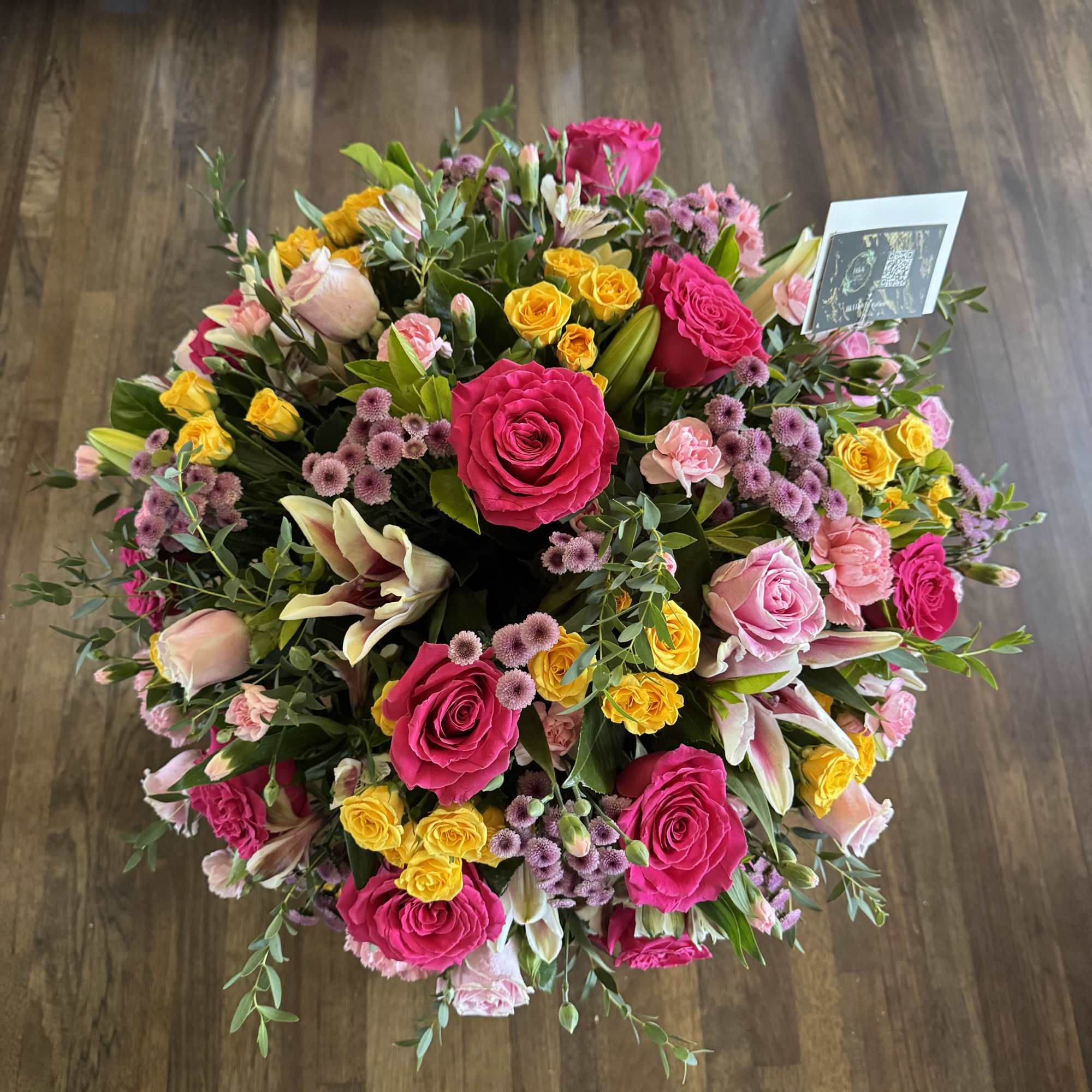 Large bouquet of pink, yellow, and lavender flowers