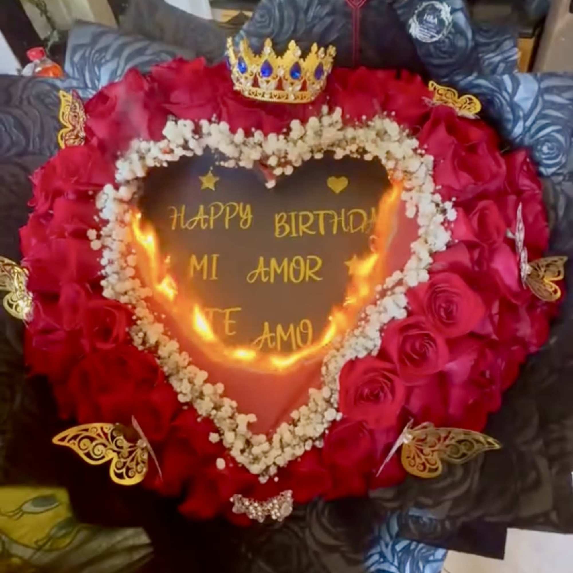 Heart-shaped rose arrangement with a birthday message and crown topper