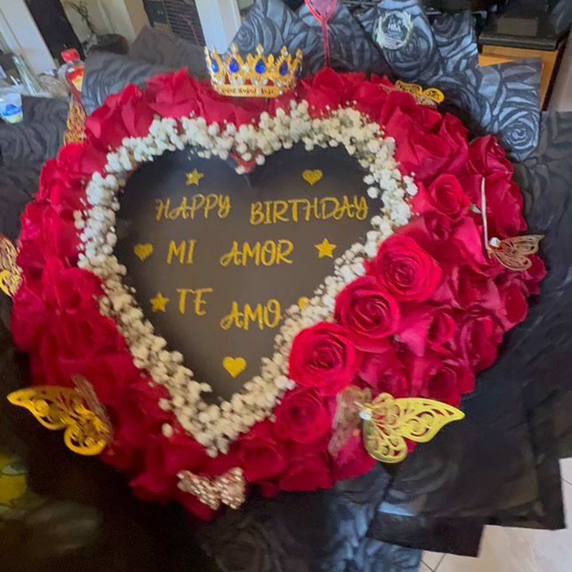 Heart-shaped rose arrangement with a birthday message in the center