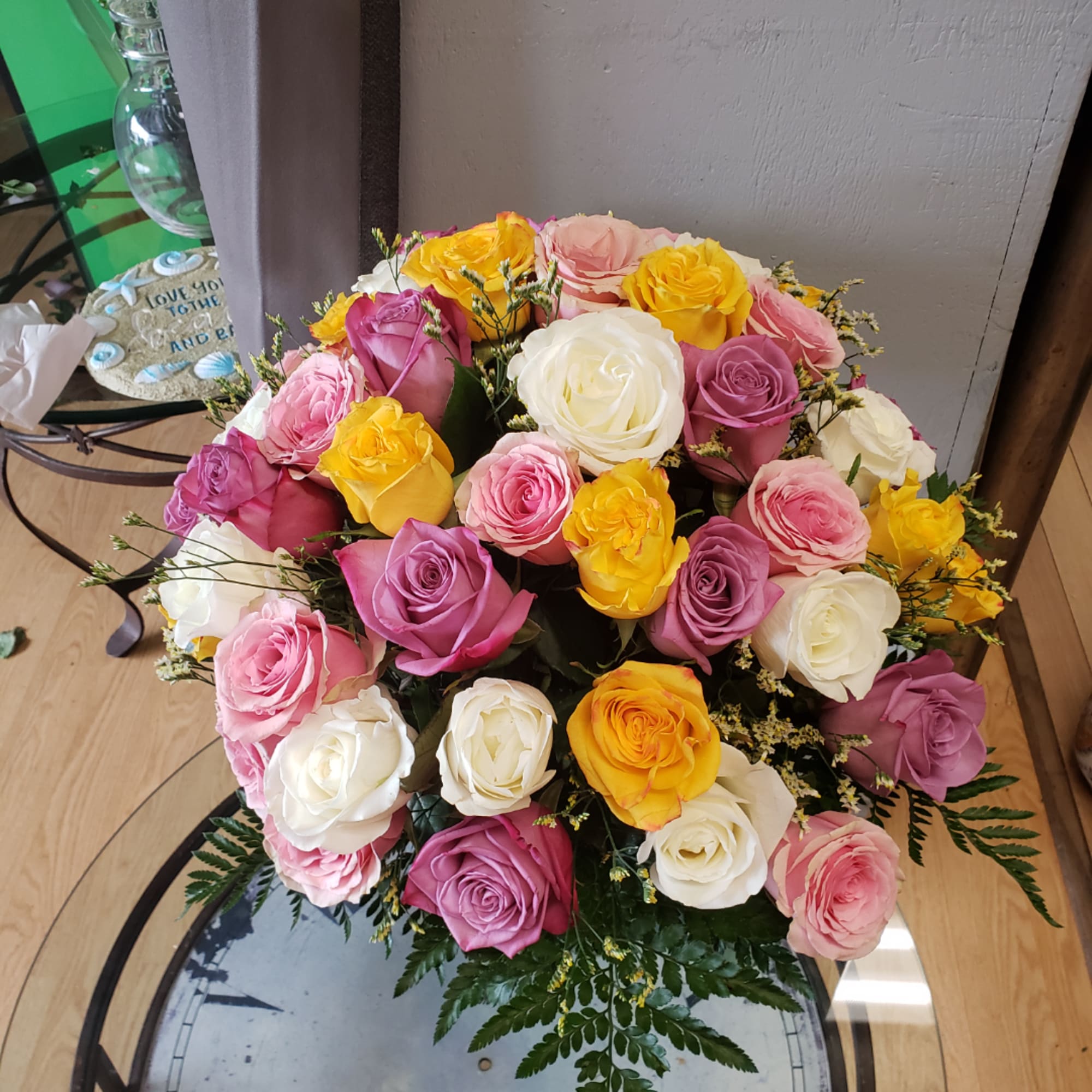 Bouquet of multicolored roses in pink, yellow, and white