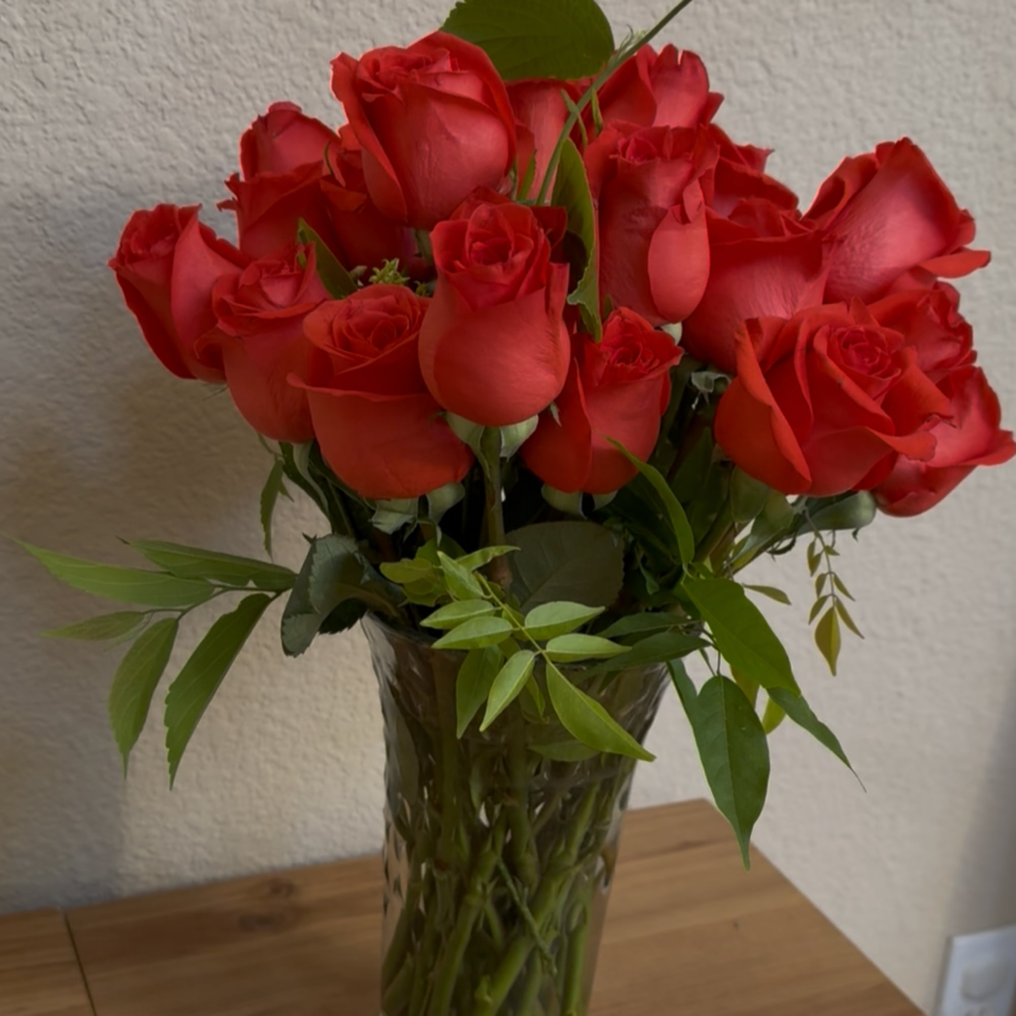 A gathering of premium radiant orange roses, deep as a lover&rsquo;s gaze