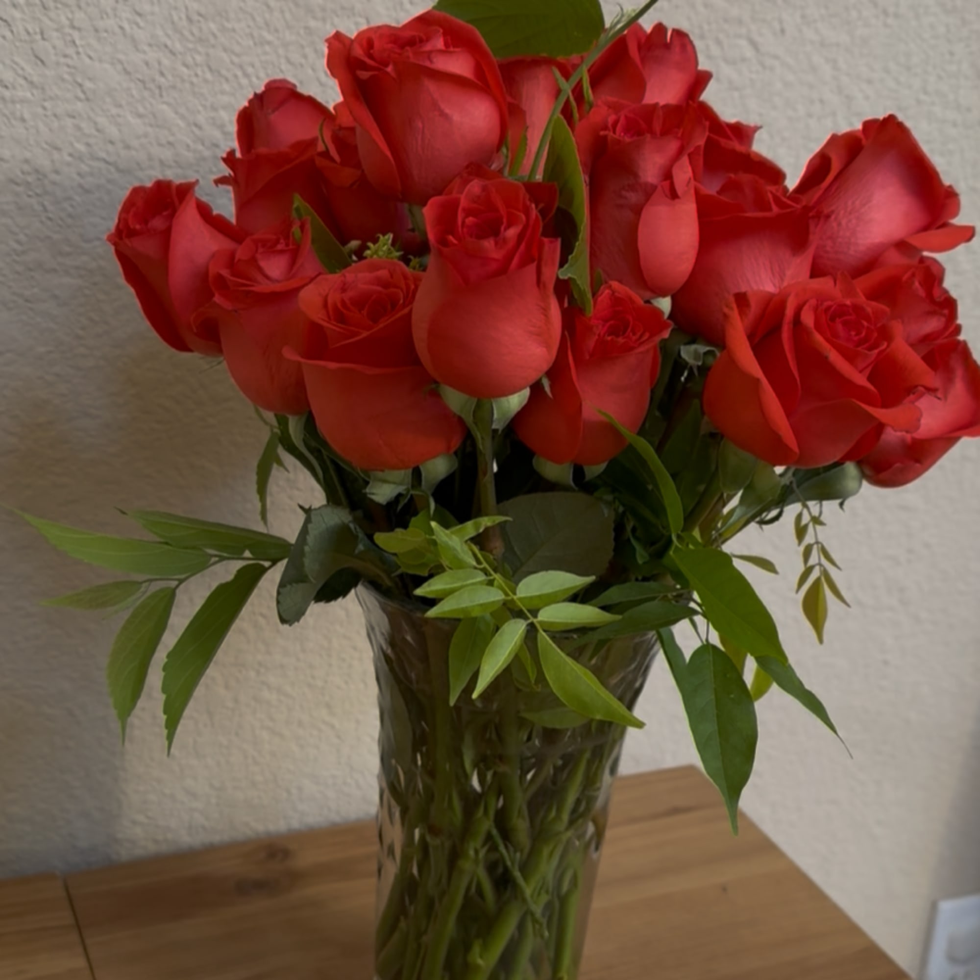 A gathering of premium radiant orange roses, deep as a lover&rsquo;s gaze
