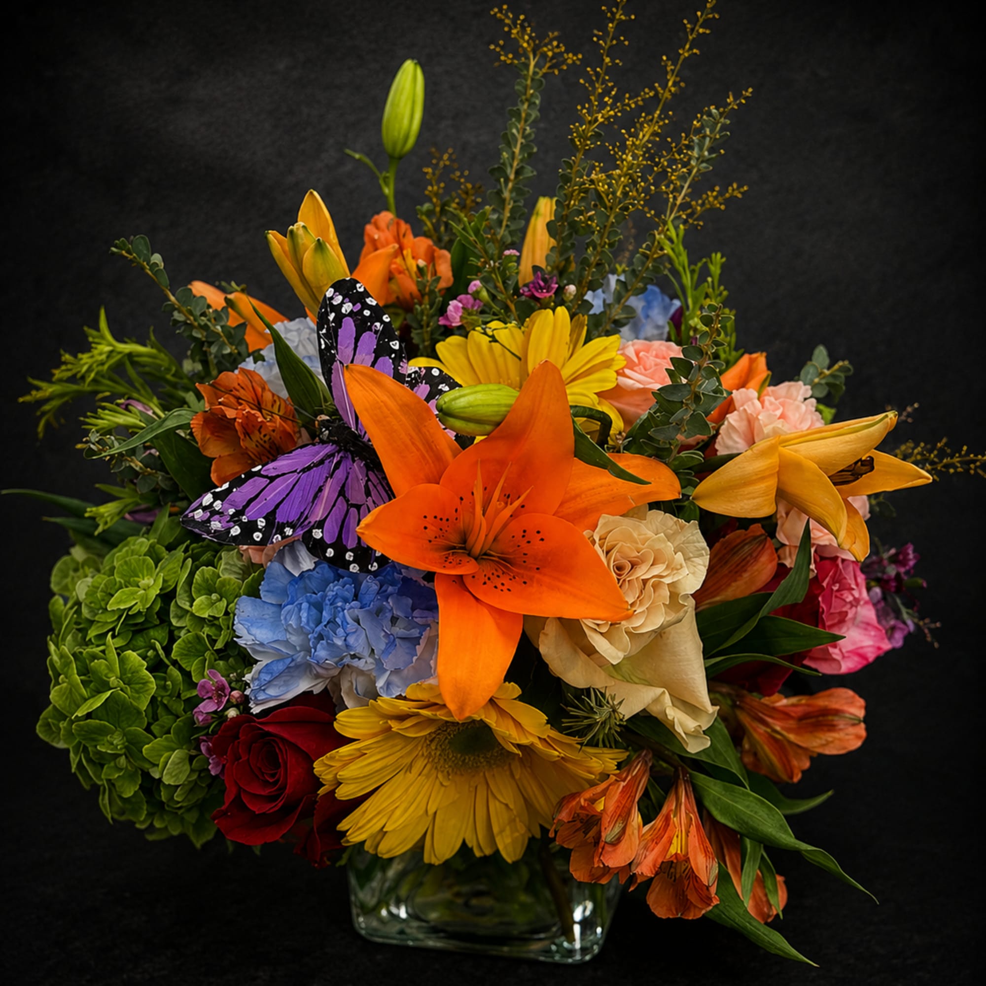 A vibrant, mixed-color Designer's Choice flower arrangement that makes a joyful anniversary