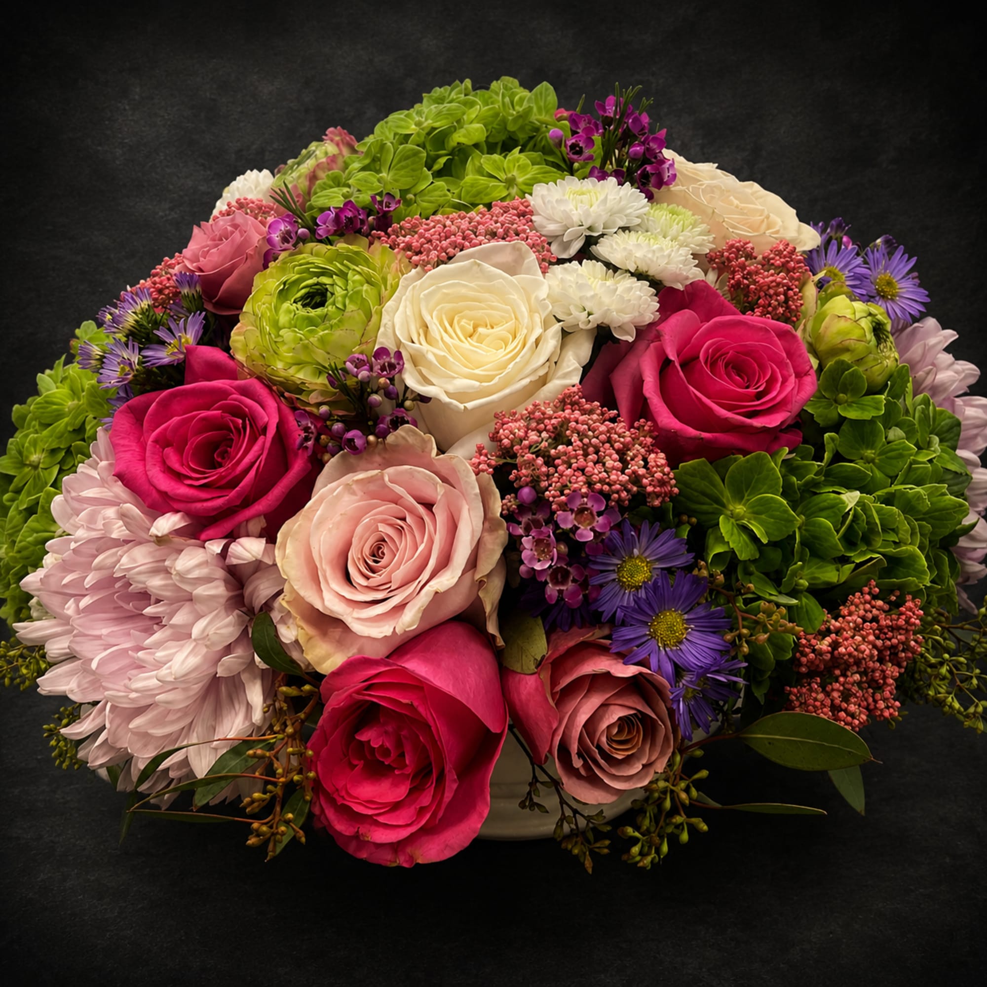 A vibrant, mixed-color Designer's Choice flower arrangement that makes a joyful anniversary