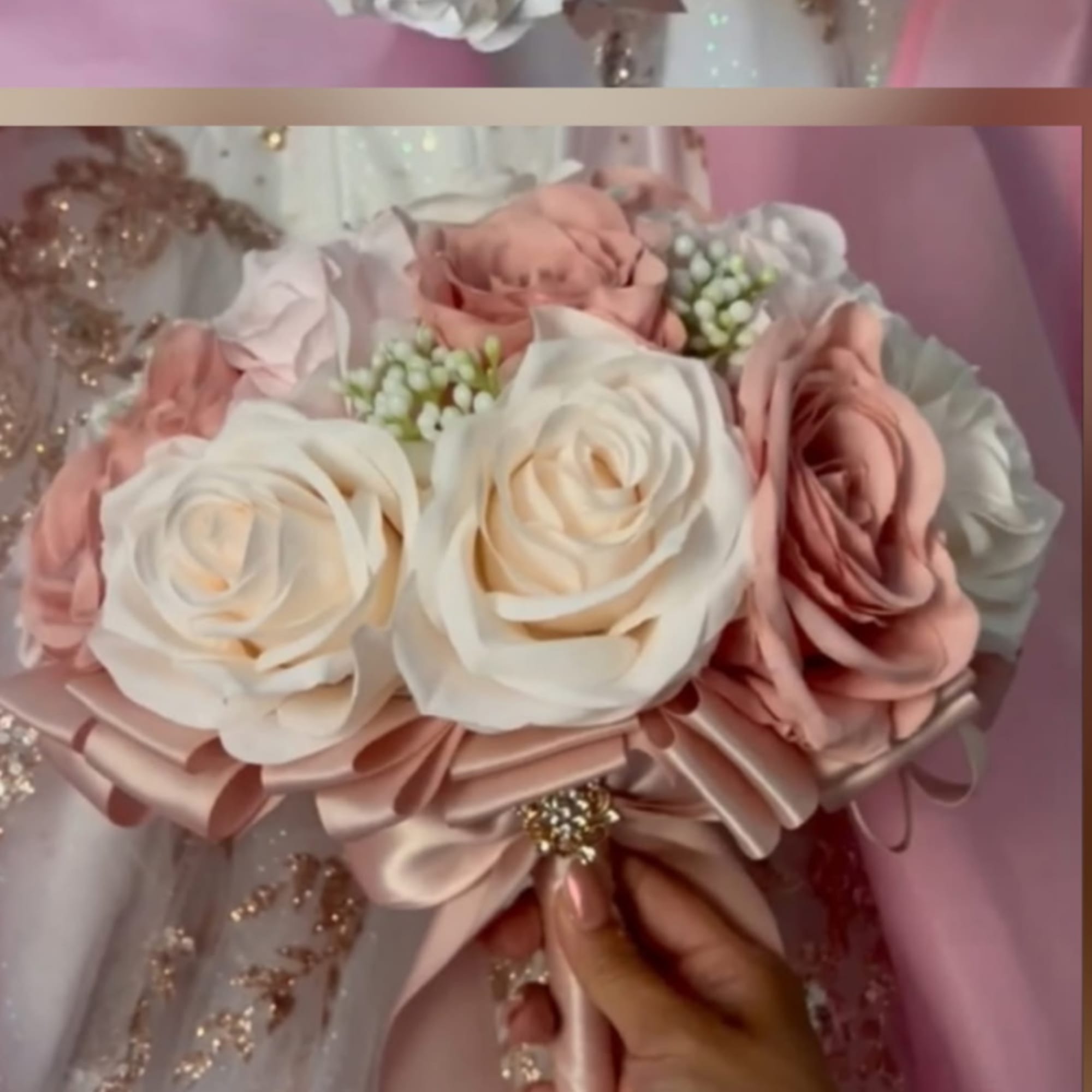 Blush and ivory rose bouquet tied with a satin ribbon