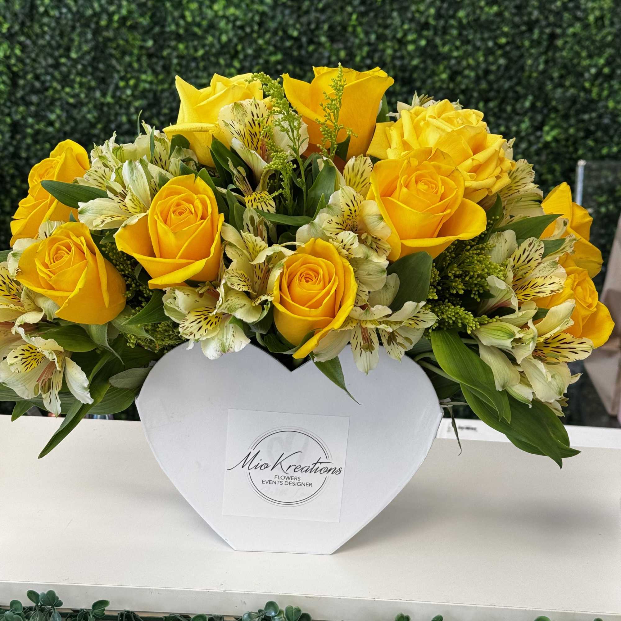 Yellow roses and white alstroemeria in a white heart-shaped box, photo 3 of 3