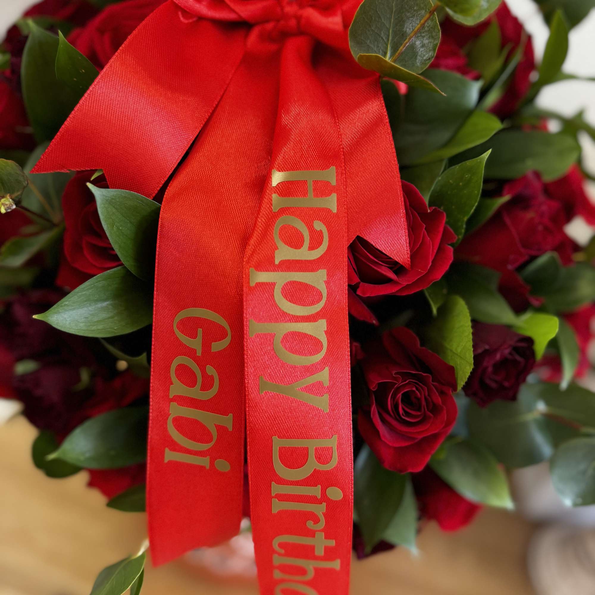 Red rose bouquet with a large birthday ribbon
