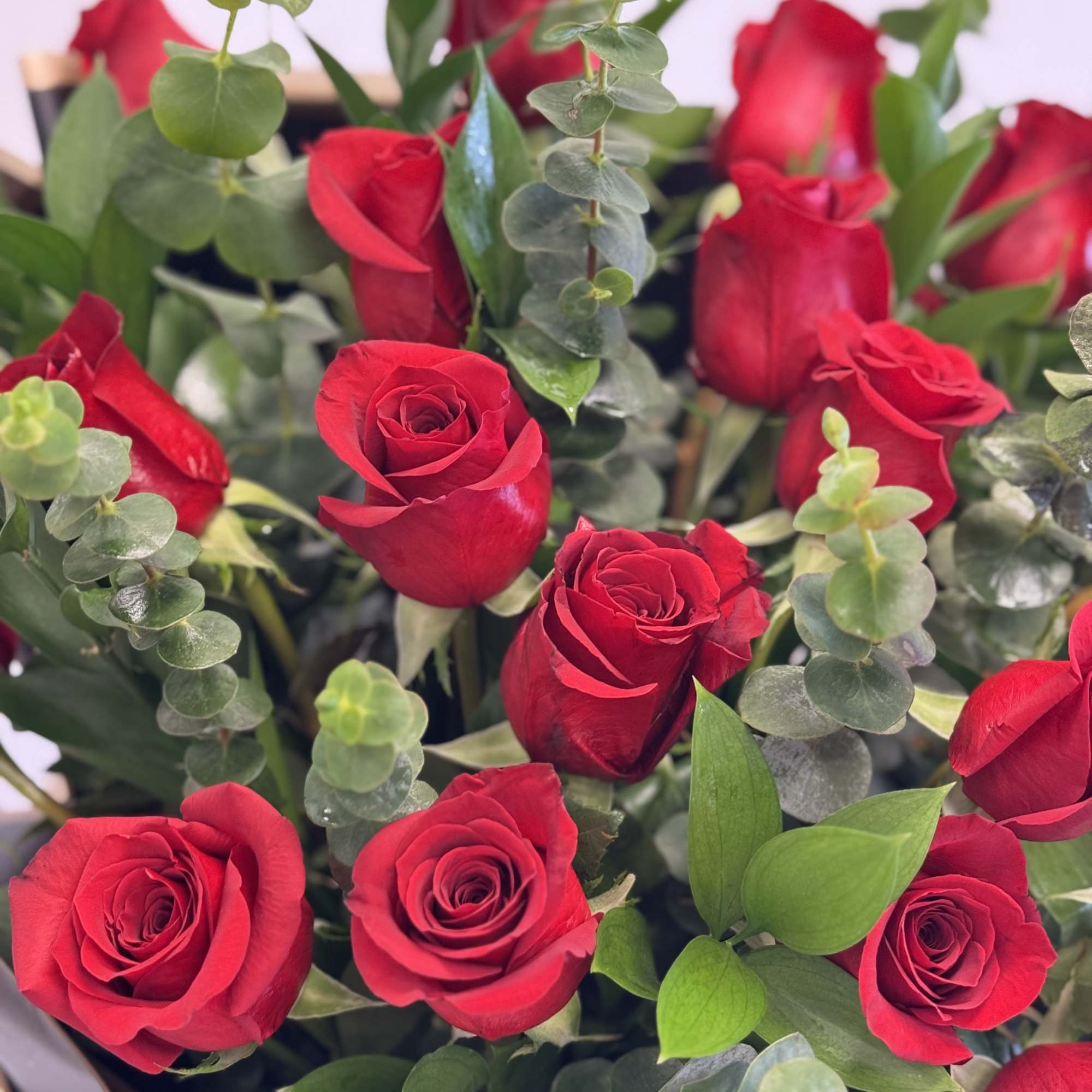 Bouquet of red roses with eucalyptus greenery