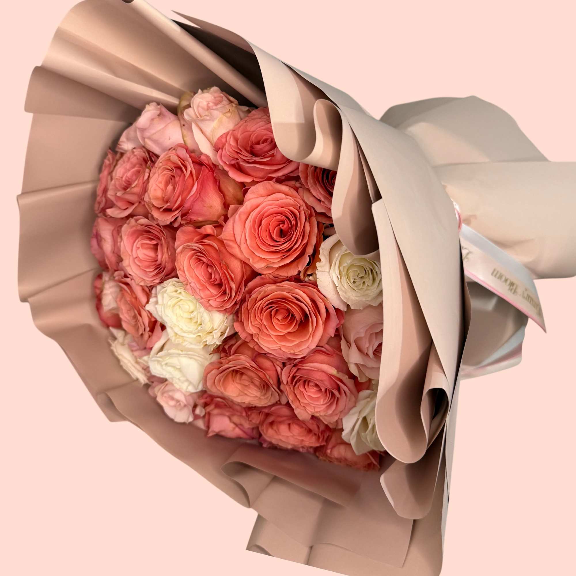 Standard - 48-50 roses
Deluxe - 73-75 roses
Premium- 99-100 roses

A sophisticated arrangement featuring