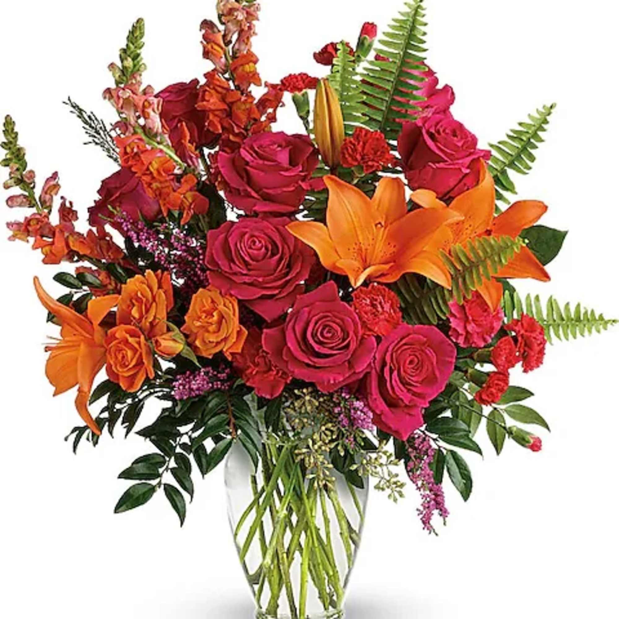 Bright bouquet of pink roses and orange lilies in a clear glass vase