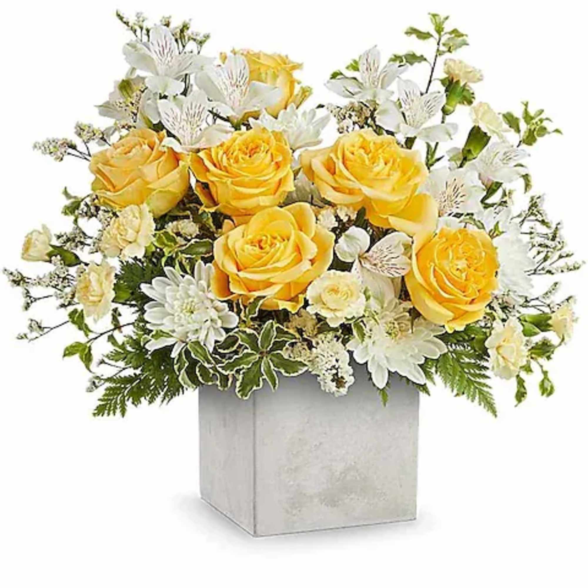 Yellow roses and white flowers arranged in a square vase