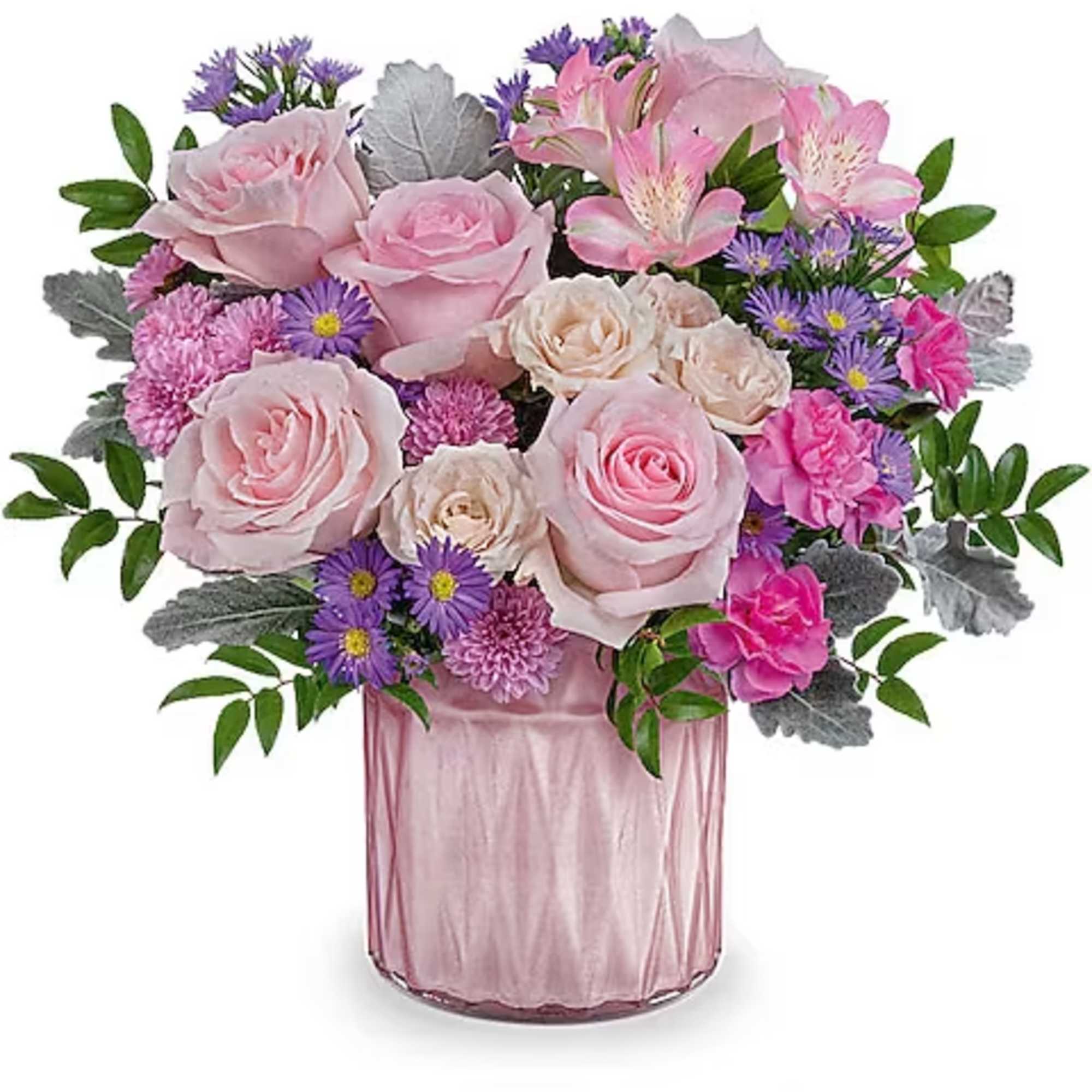 Pink roses and mixed flowers arranged in a pink glass vase