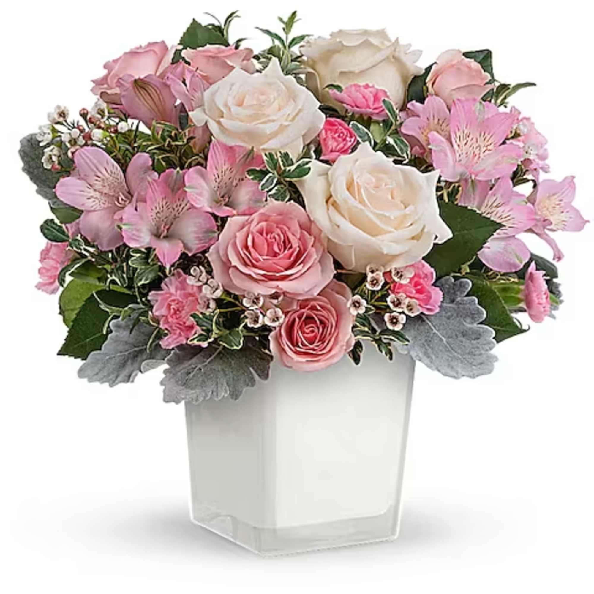 Pink and white rose bouquet in a clear square vase