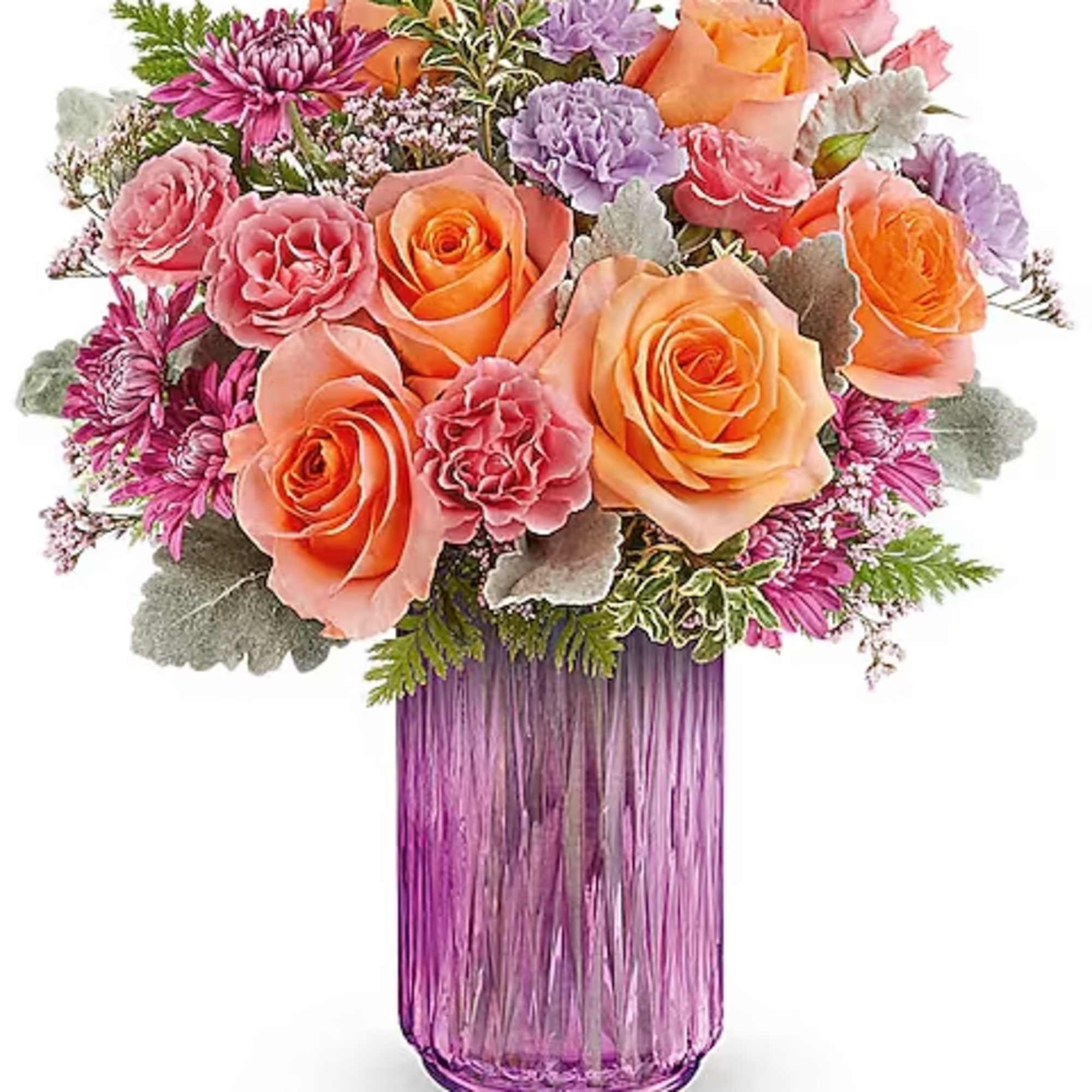 Bouquet of peach and pink roses in a purple glass vase