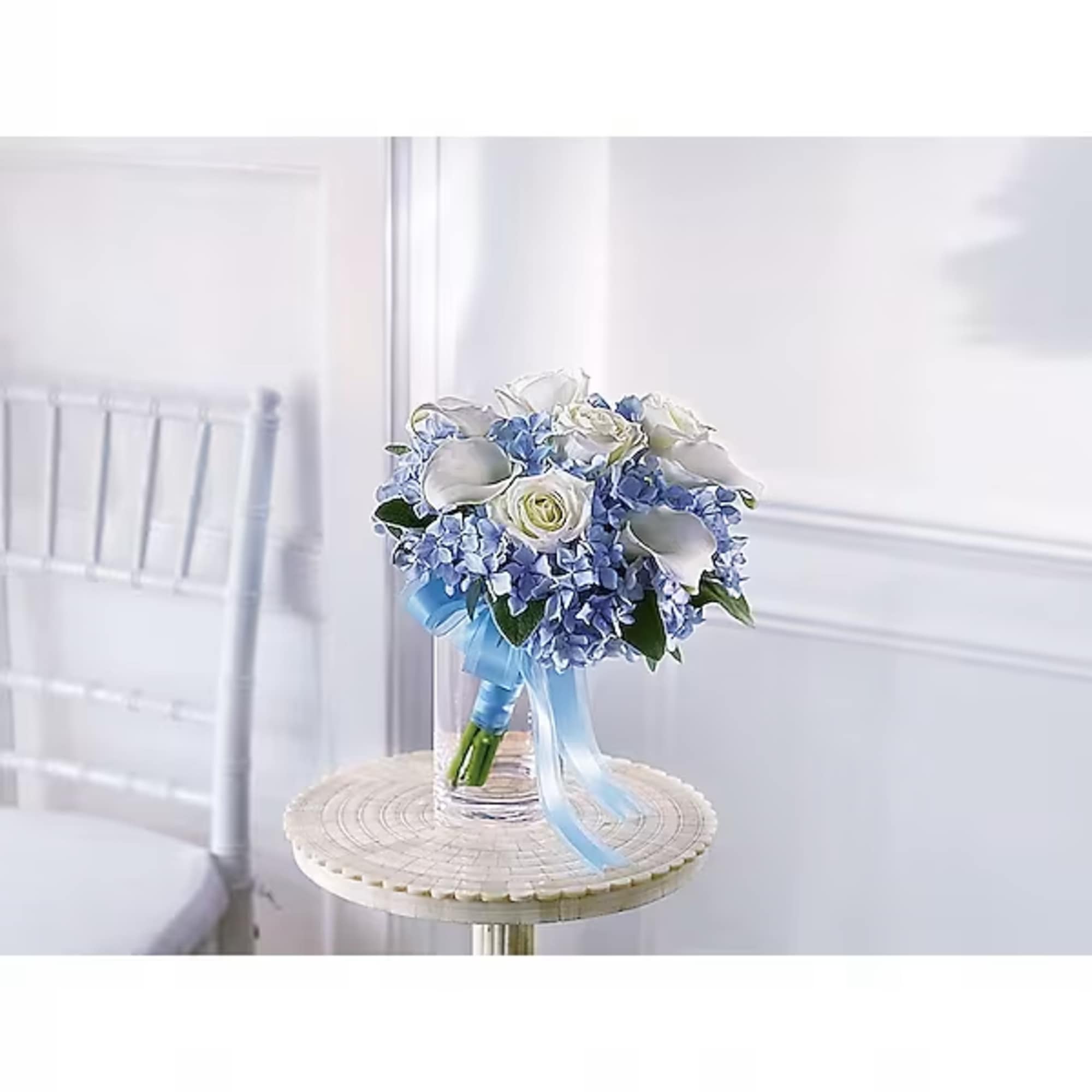 Blue and white bridal bouquet with roses and calla lilies