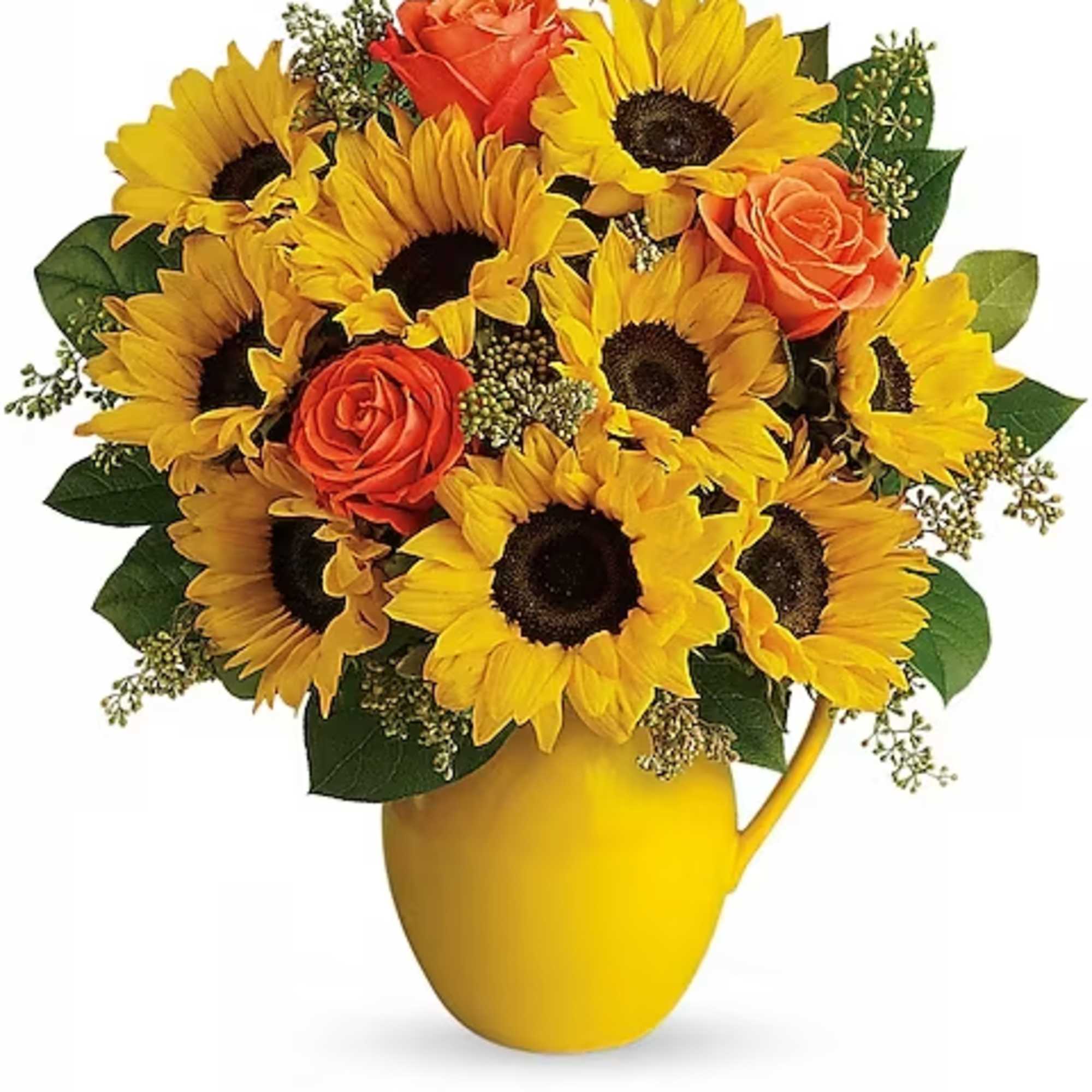 Sunflower and orange rose bouquet in a yellow pitcher vase