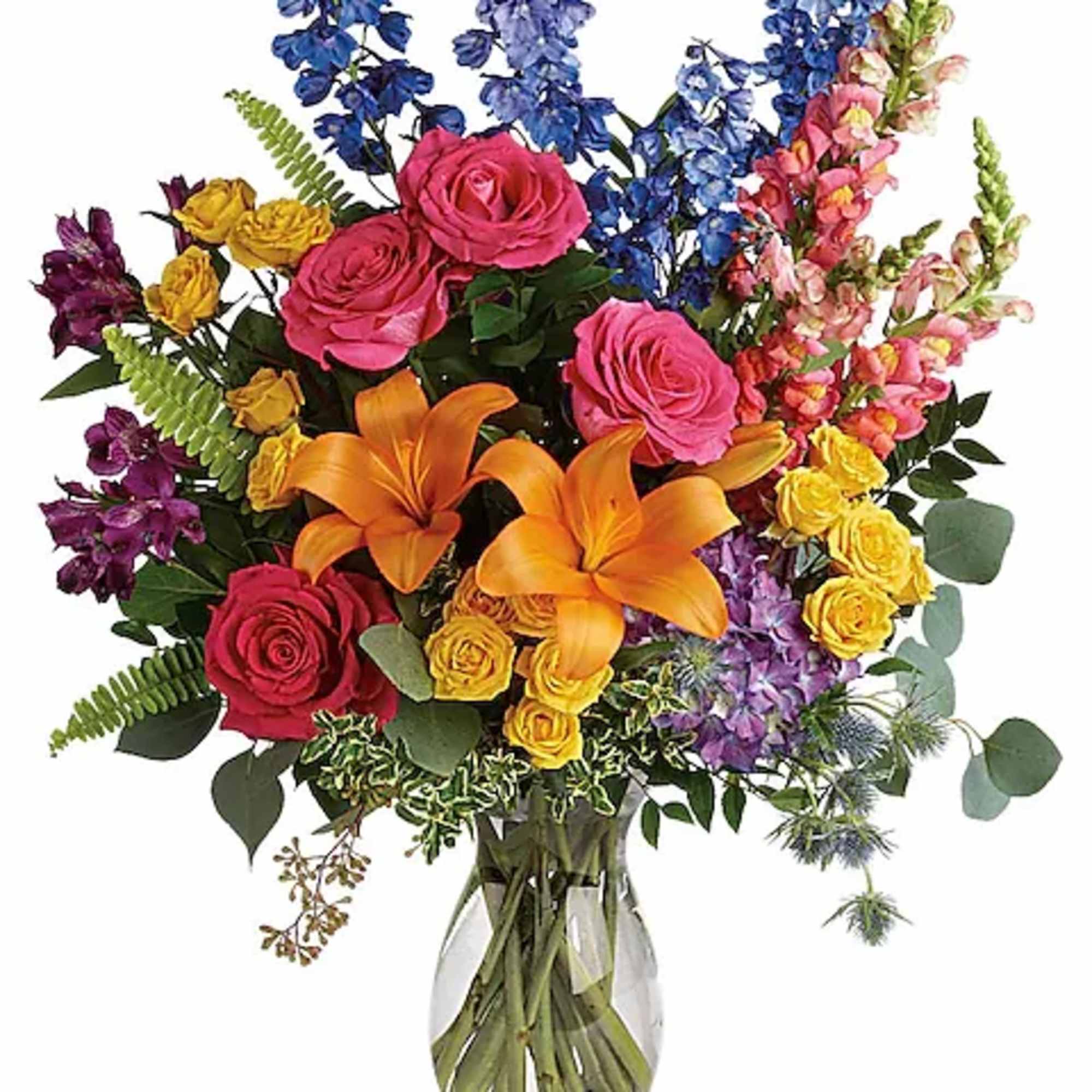 Colorful bouquet of roses, lilies, and snapdragons in a glass vase