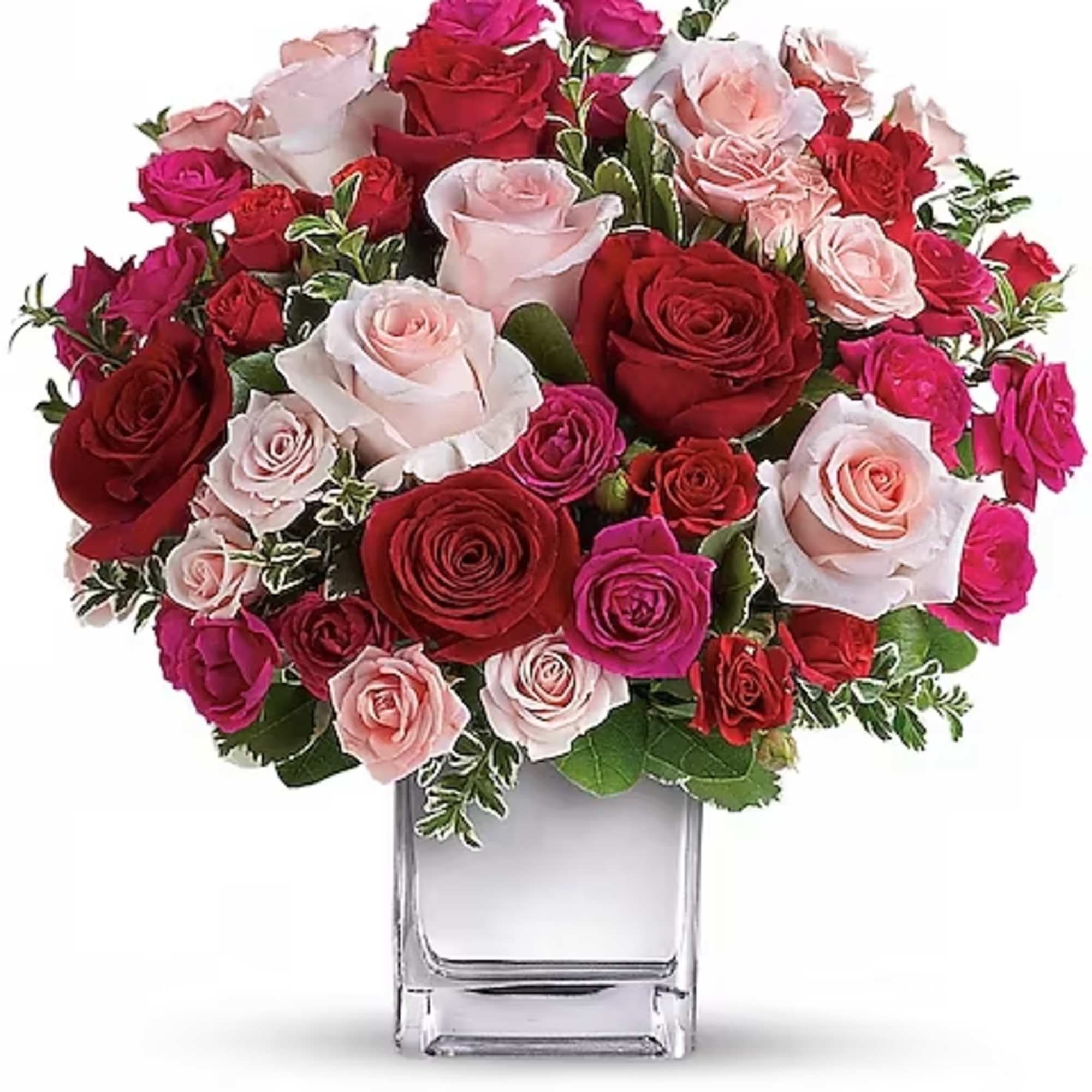Bouquet of red, pink, and white roses in a clear glass vase