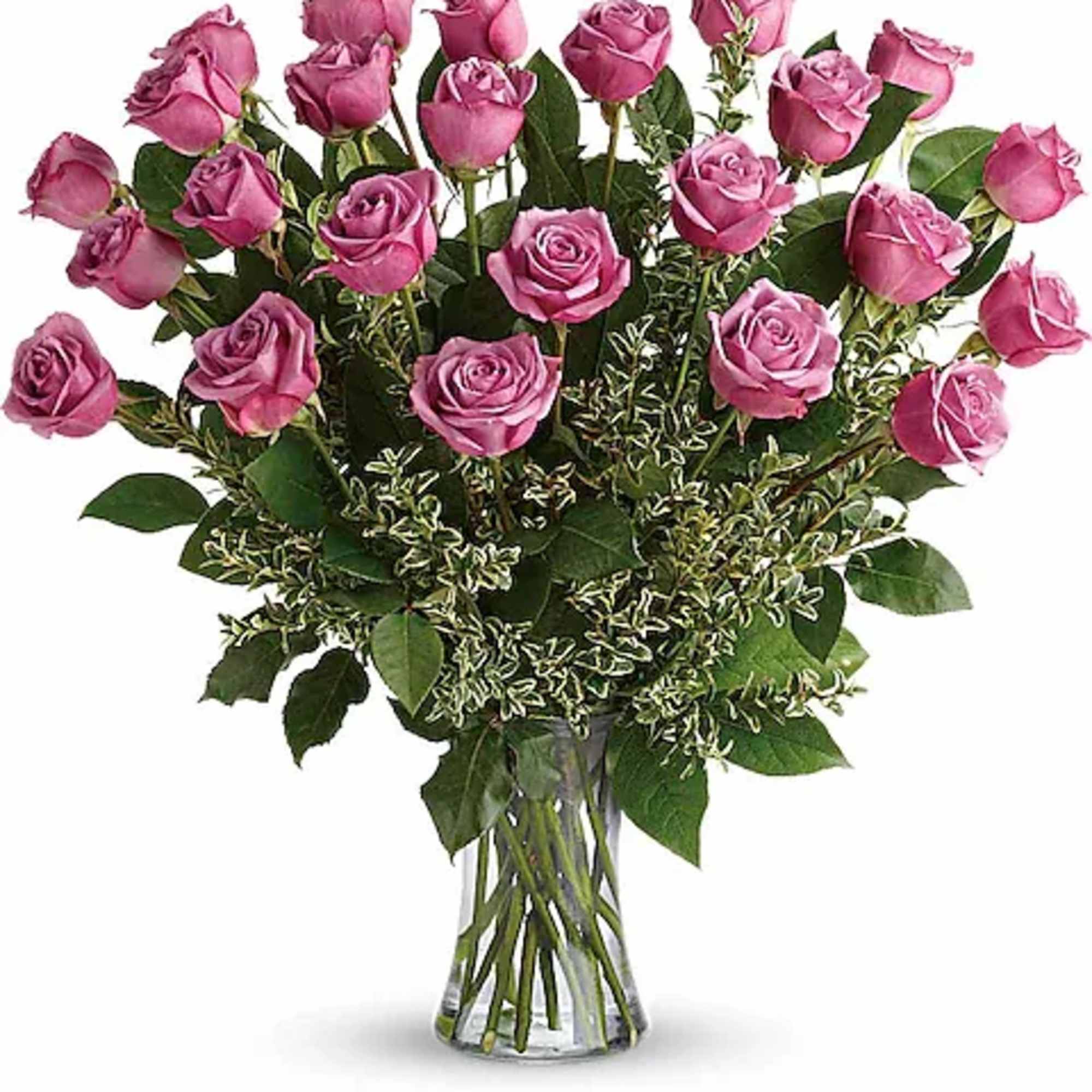 Pink roses arranged in a clear glass vase