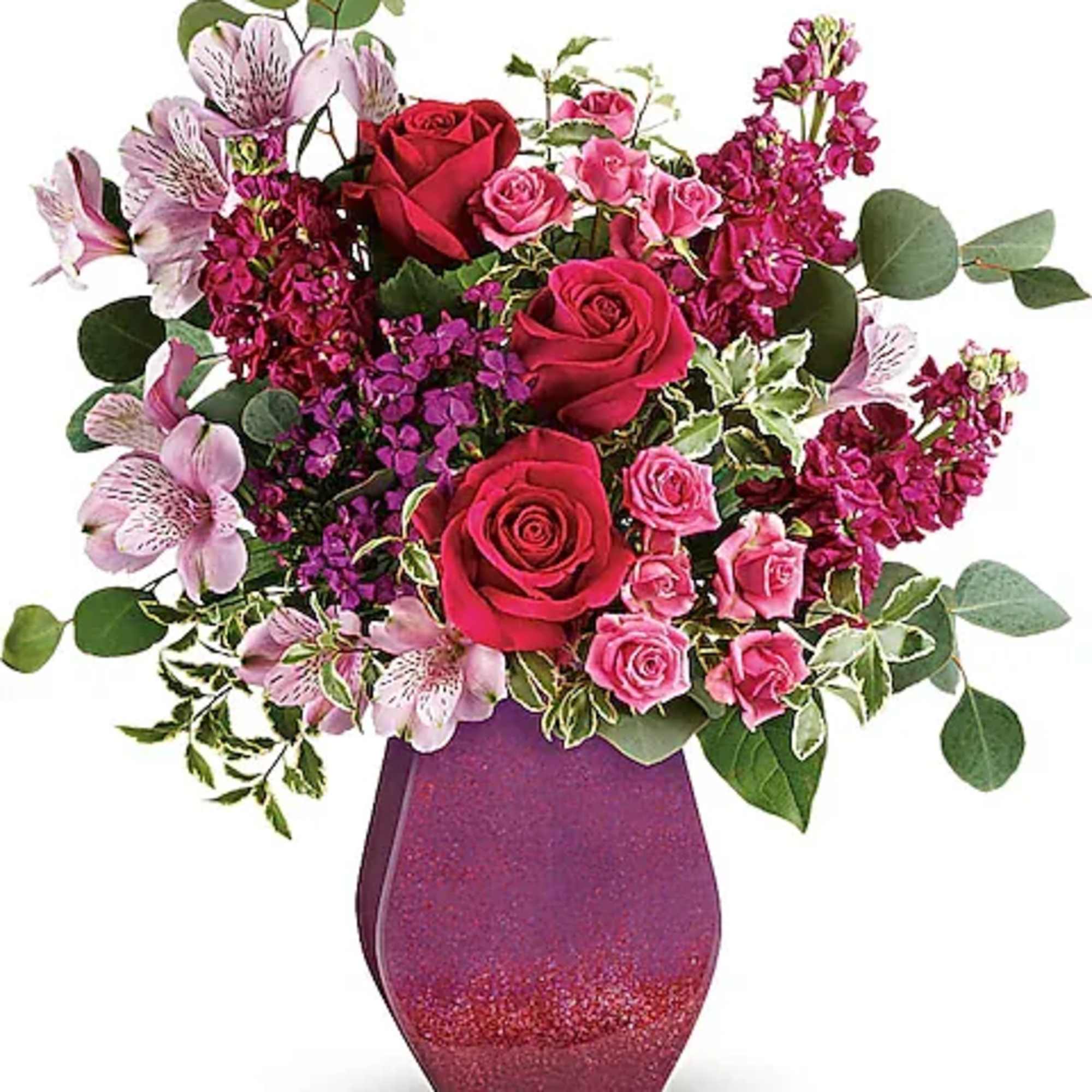 Bouquet of red and pink roses in a glittery purple vase