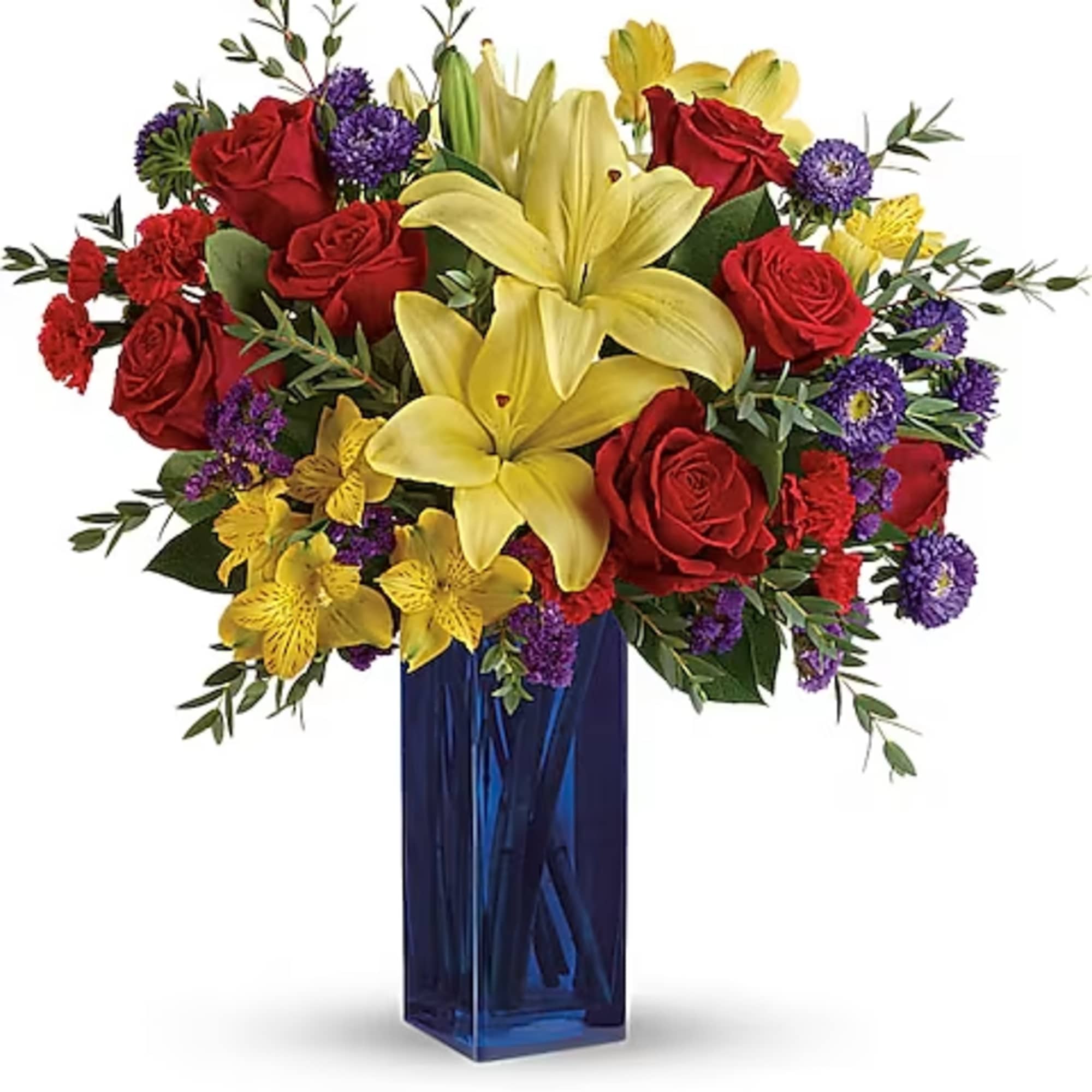 Bouquet of red roses and yellow lilies in a blue glass vase