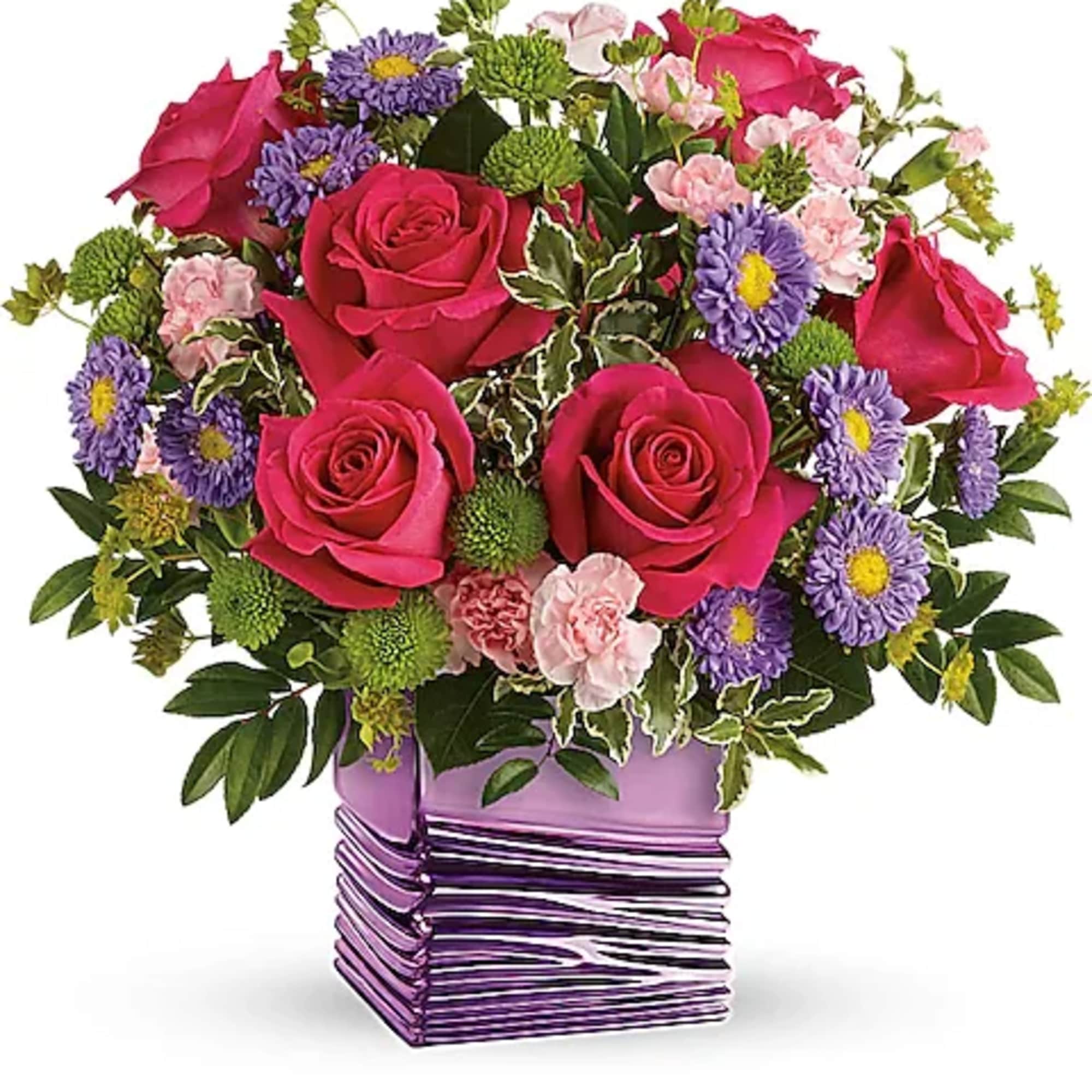 Bouquet of pink roses and purple daisies in a purple vase