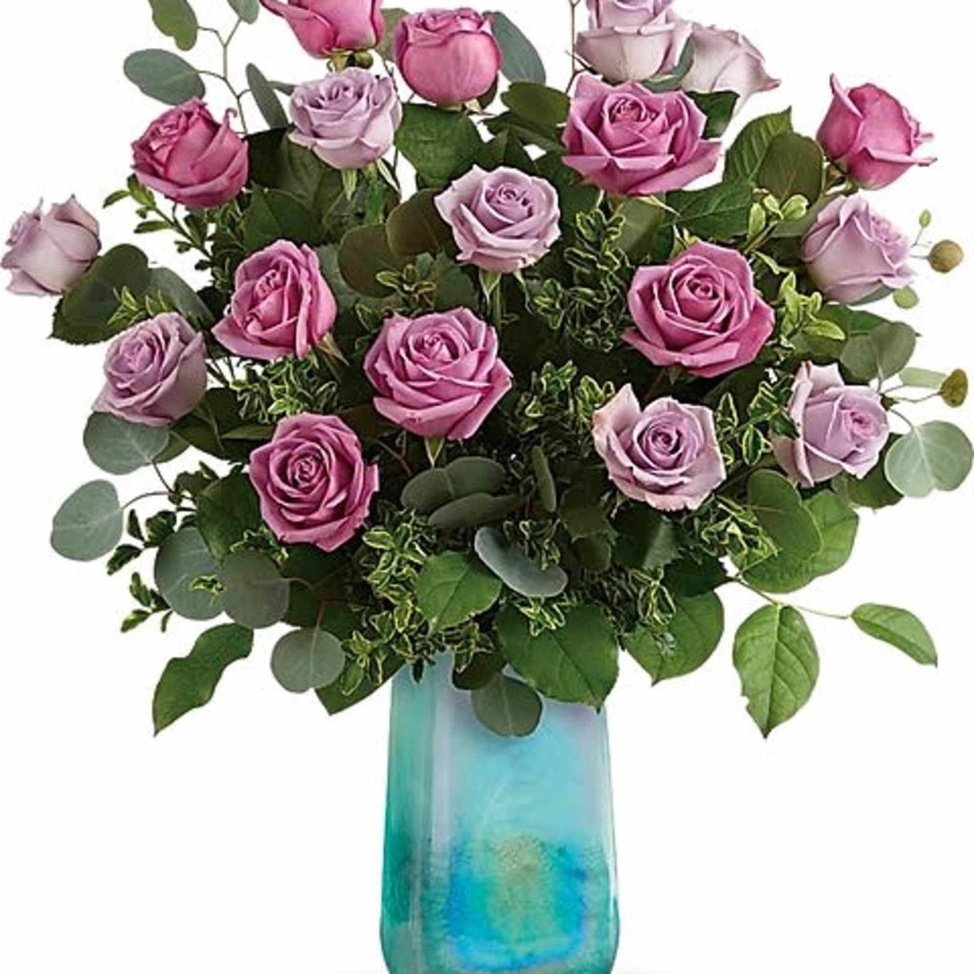 Pink and lavender roses in a blue glass vase