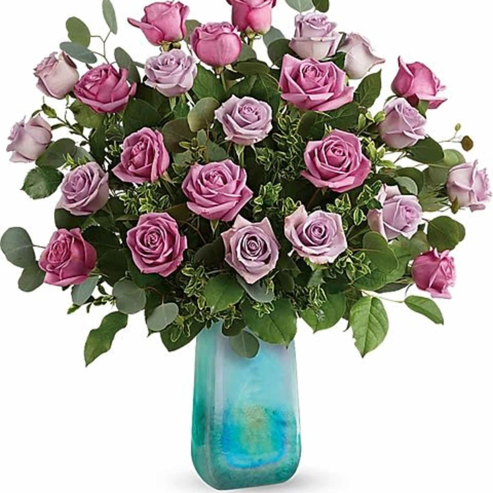 Pink and lavender roses in a blue glass vase