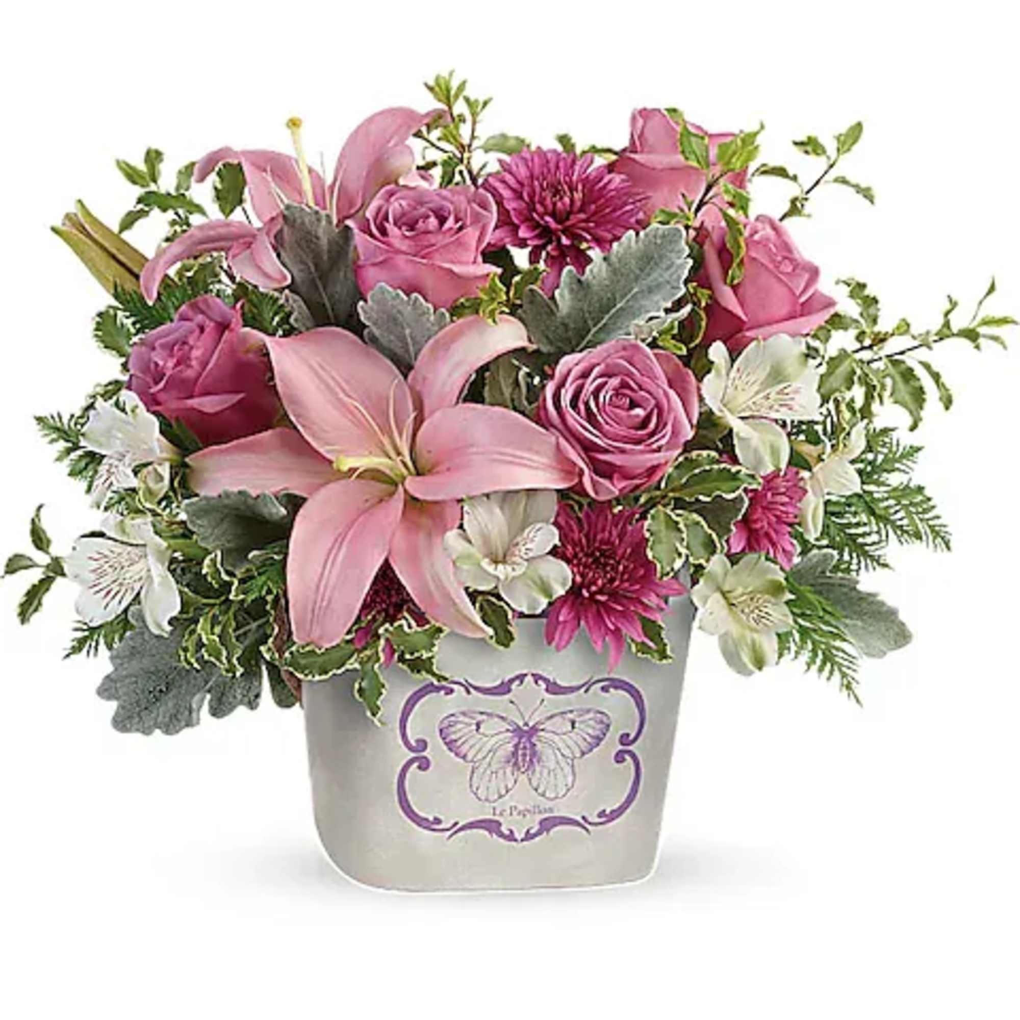 Pink lilies and roses arranged in a decorative pot