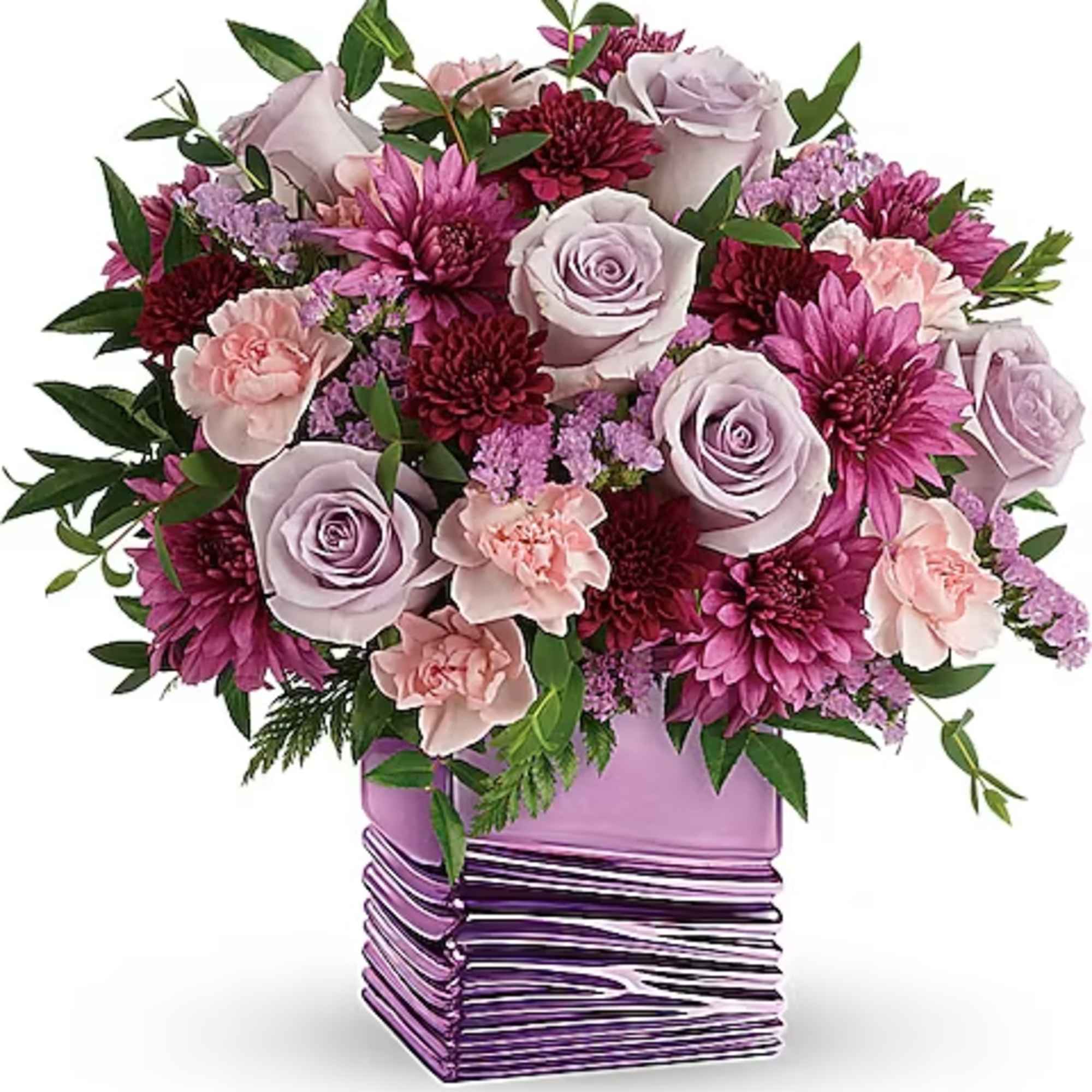 Bouquet of lavender roses, pink carnations, and purple mums in a purple vase