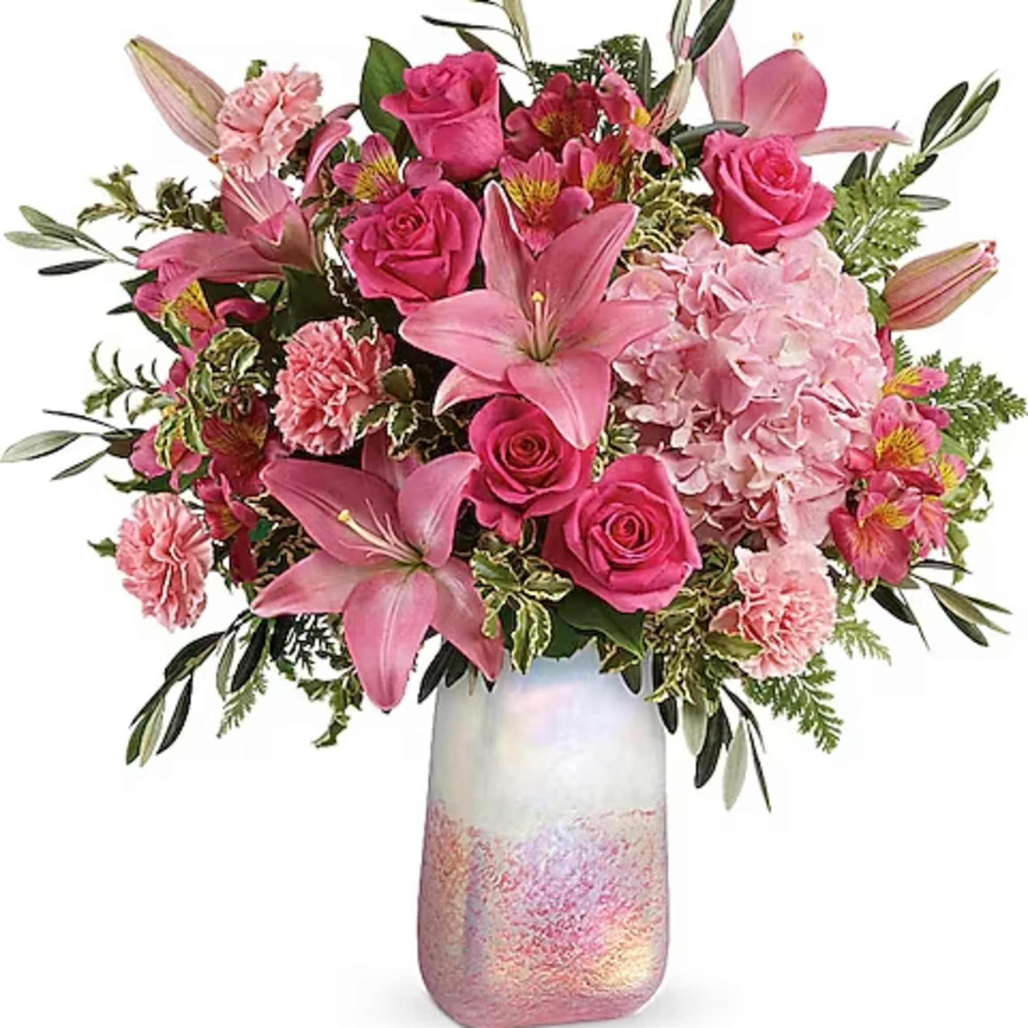 Pink roses and lilies arranged in a tall iridescent vase