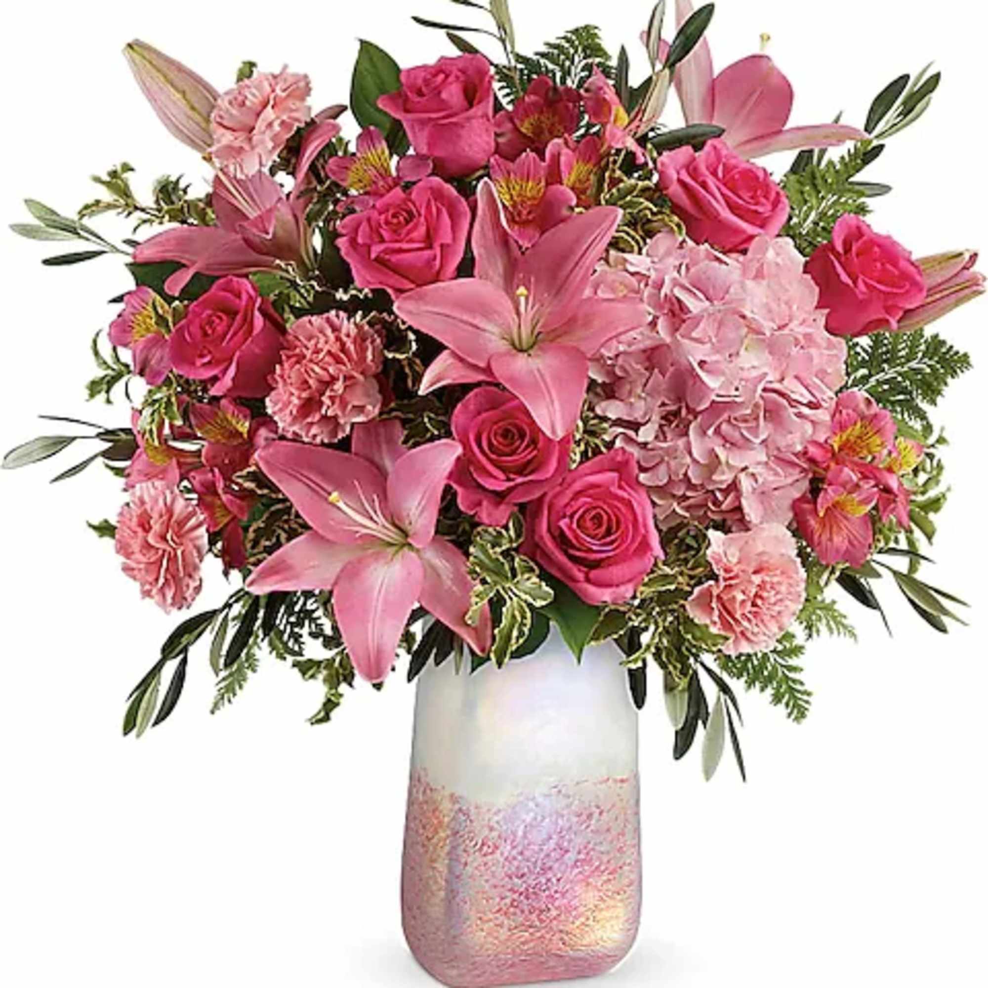 Pink roses and lilies arranged in a tall iridescent vase