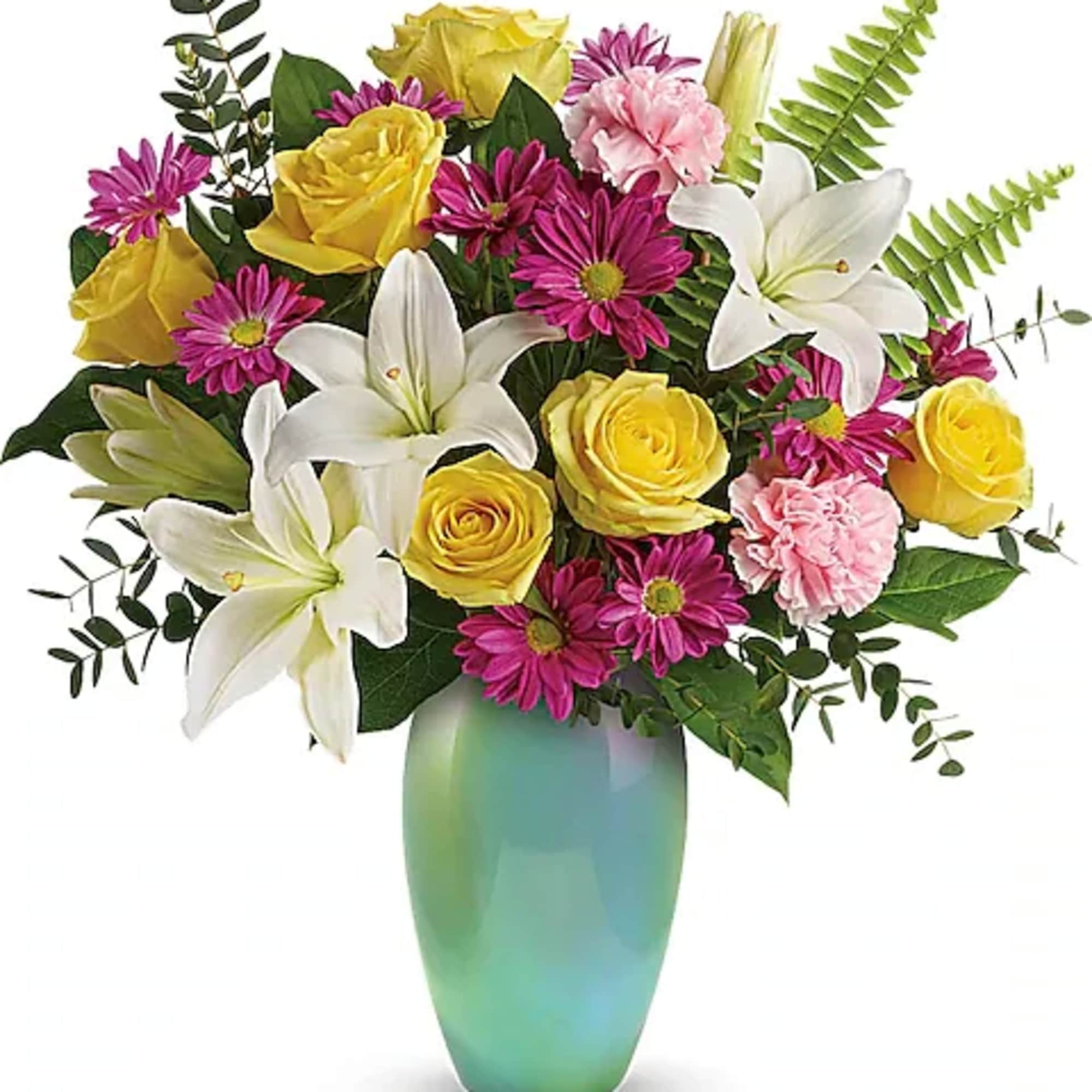 Bouquet of yellow roses, white lilies, and pink daisies in a green vase