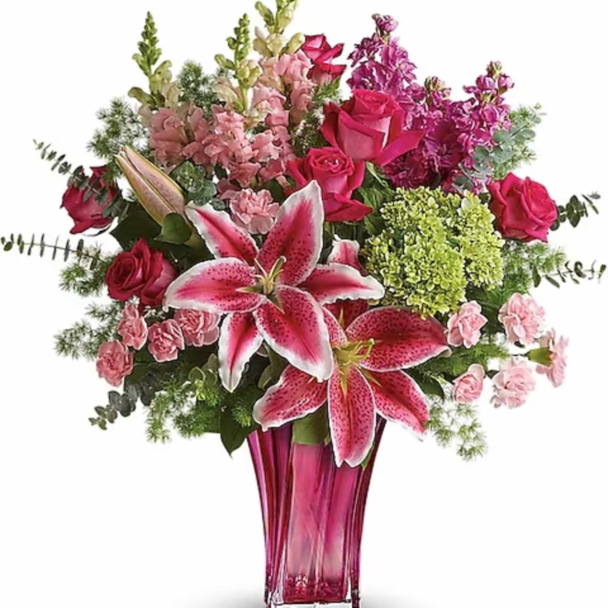Pink lilies and roses arranged in a tall magenta vase