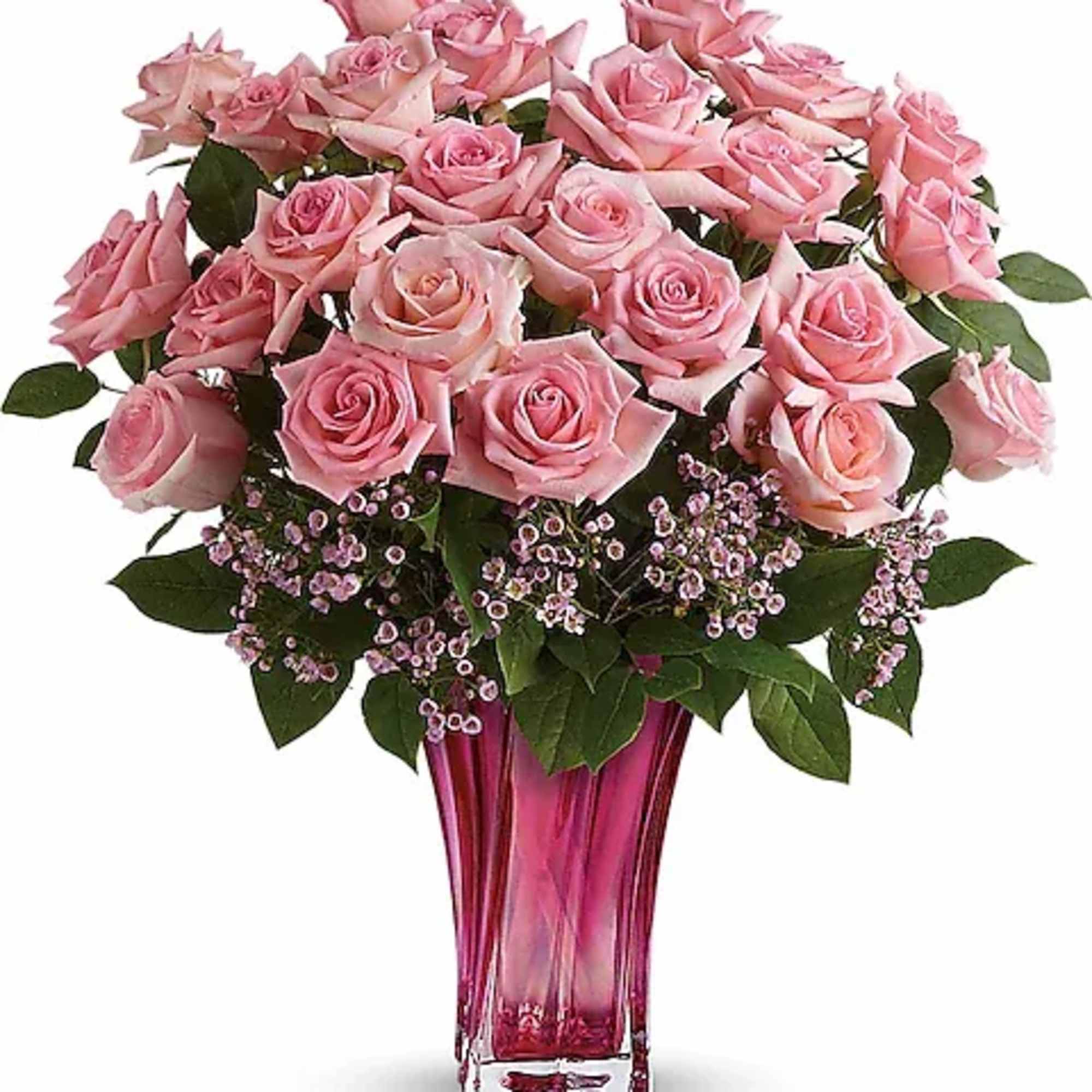 Pink roses arranged in a tall pink glass vase