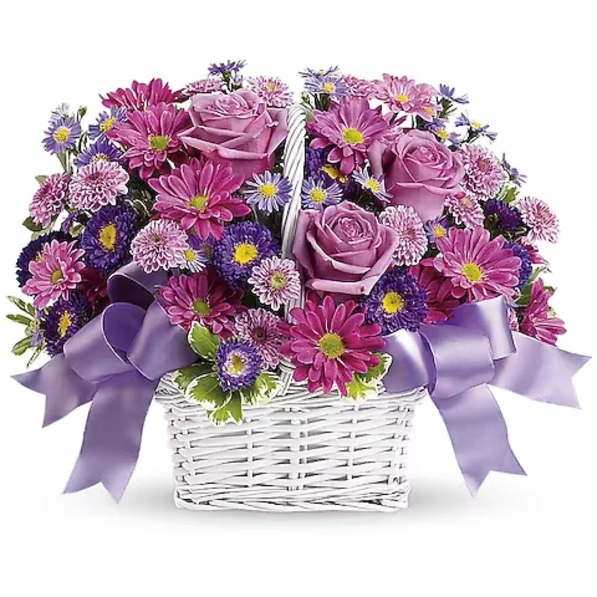 Pink and purple flowers in a white wicker basket with lavender ribbons