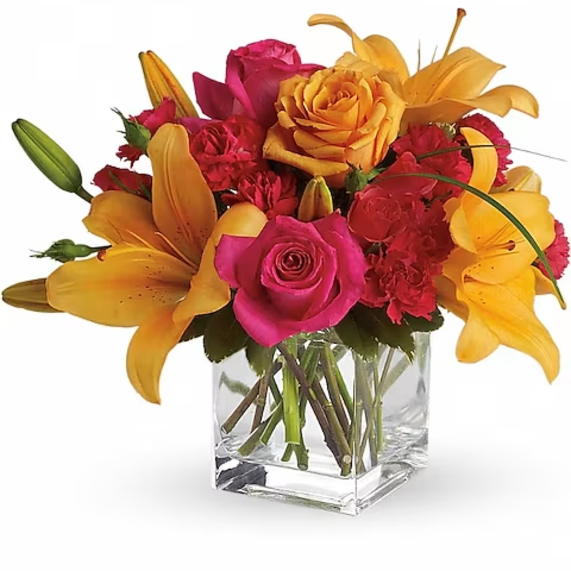 Bouquet of pink roses and yellow lilies in a clear glass vase