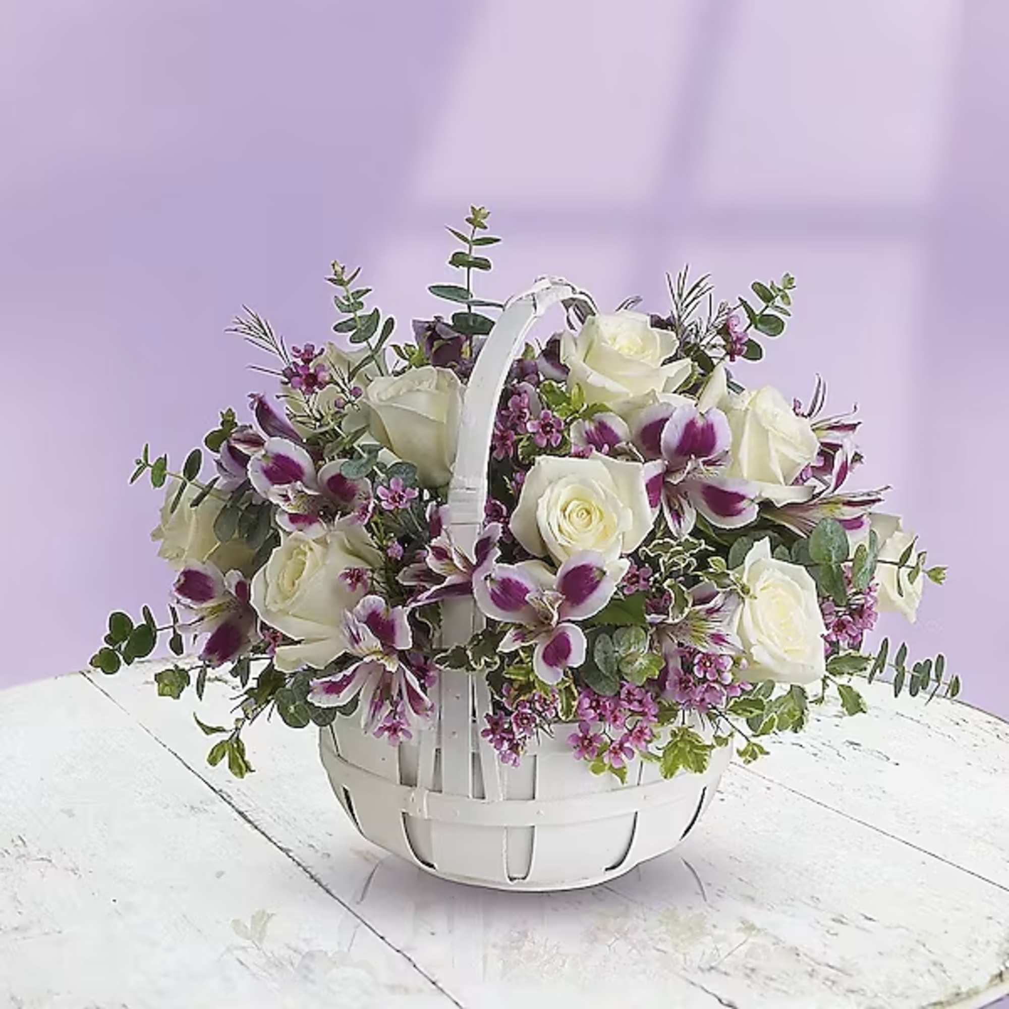 White roses and purple orchids in a white basket, photo 2 of 2