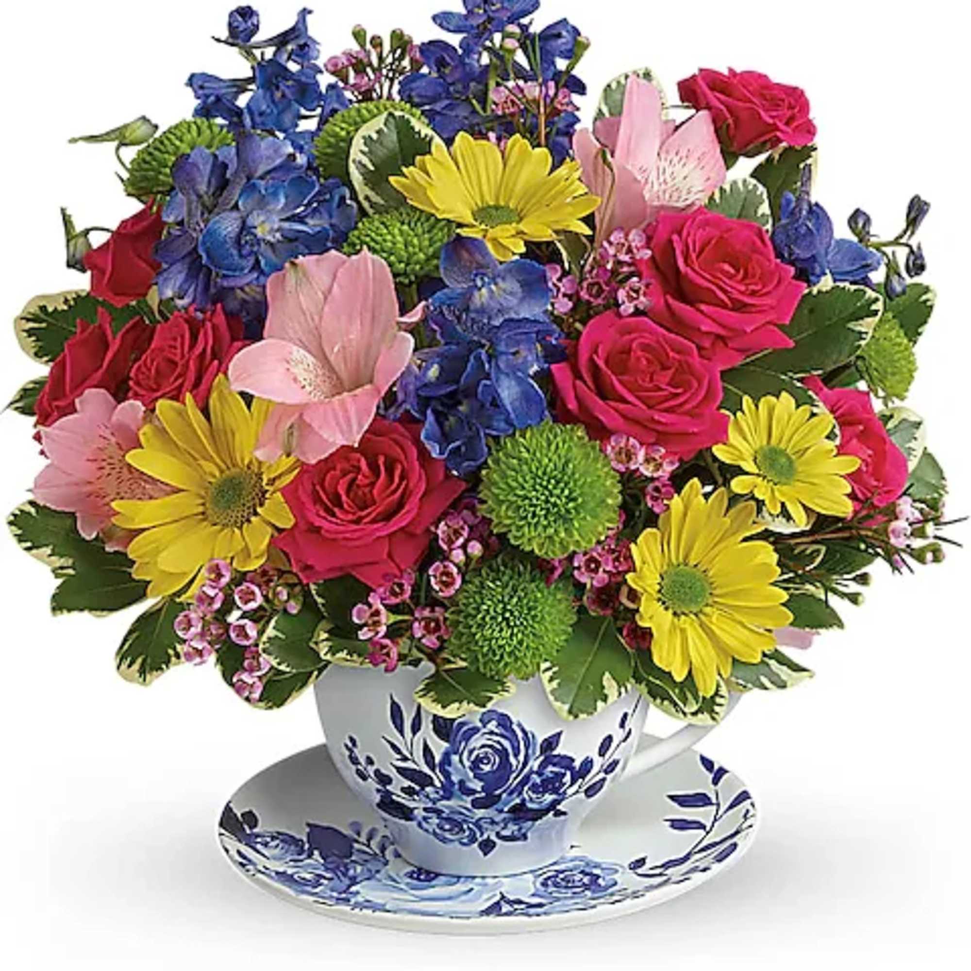 Colorful bouquet in a teacup vase with matching saucer